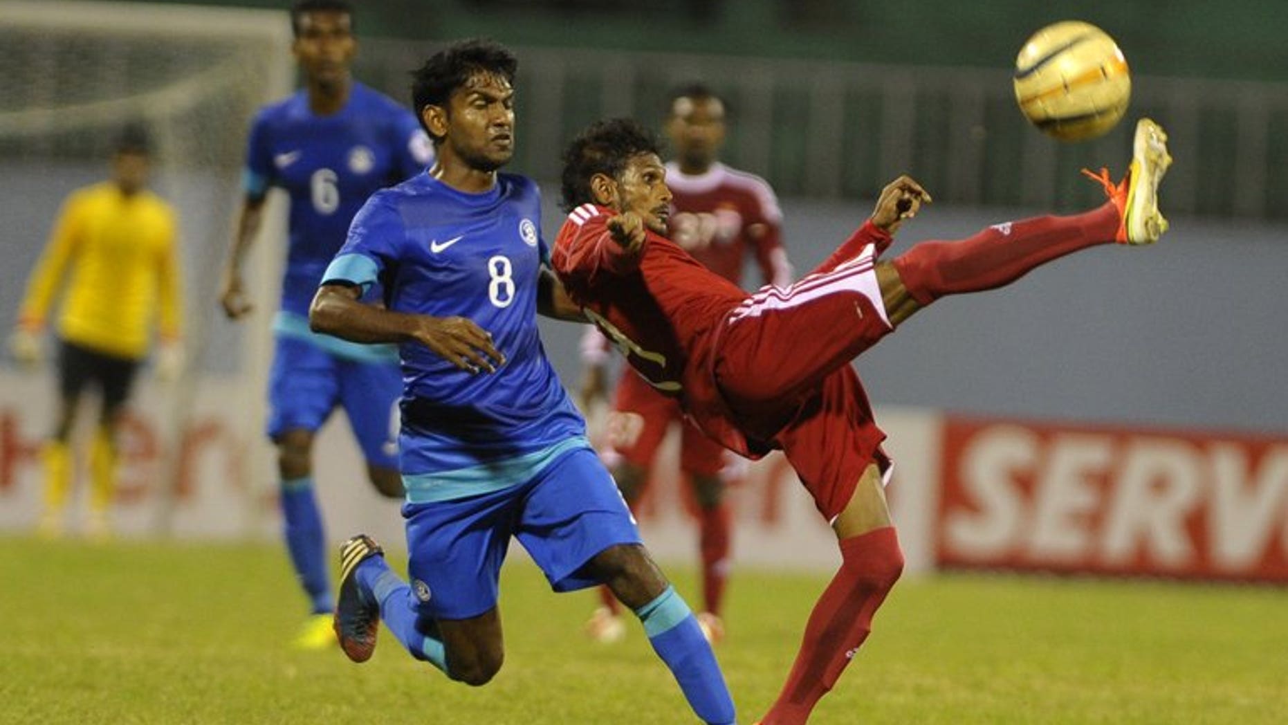 India's Francisco Fernandens (left) vies with Maldives' Akram abul Gani (right) during their SAFF Championships semi-final football match in Kathmandu on September 9, 2013. India won 1-0. The Maldives' football coach has blamed a disputed penalty decision for flared tempers after his team's 1-0 loss to India which saw a player assault the referee and the police called in to restore calm.