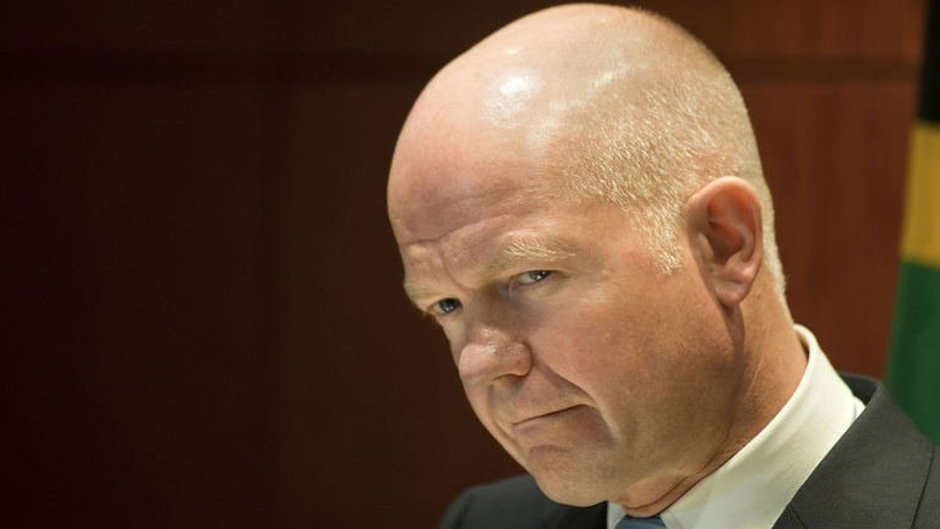 Foreign Secretary William Hague gives a press conference on September 10, 2013, in Cape Town. Britain would back any "credible" UN Security Council resolution on Syria's chemical weapons programme, but it must contain the threat of force, Hague said.
