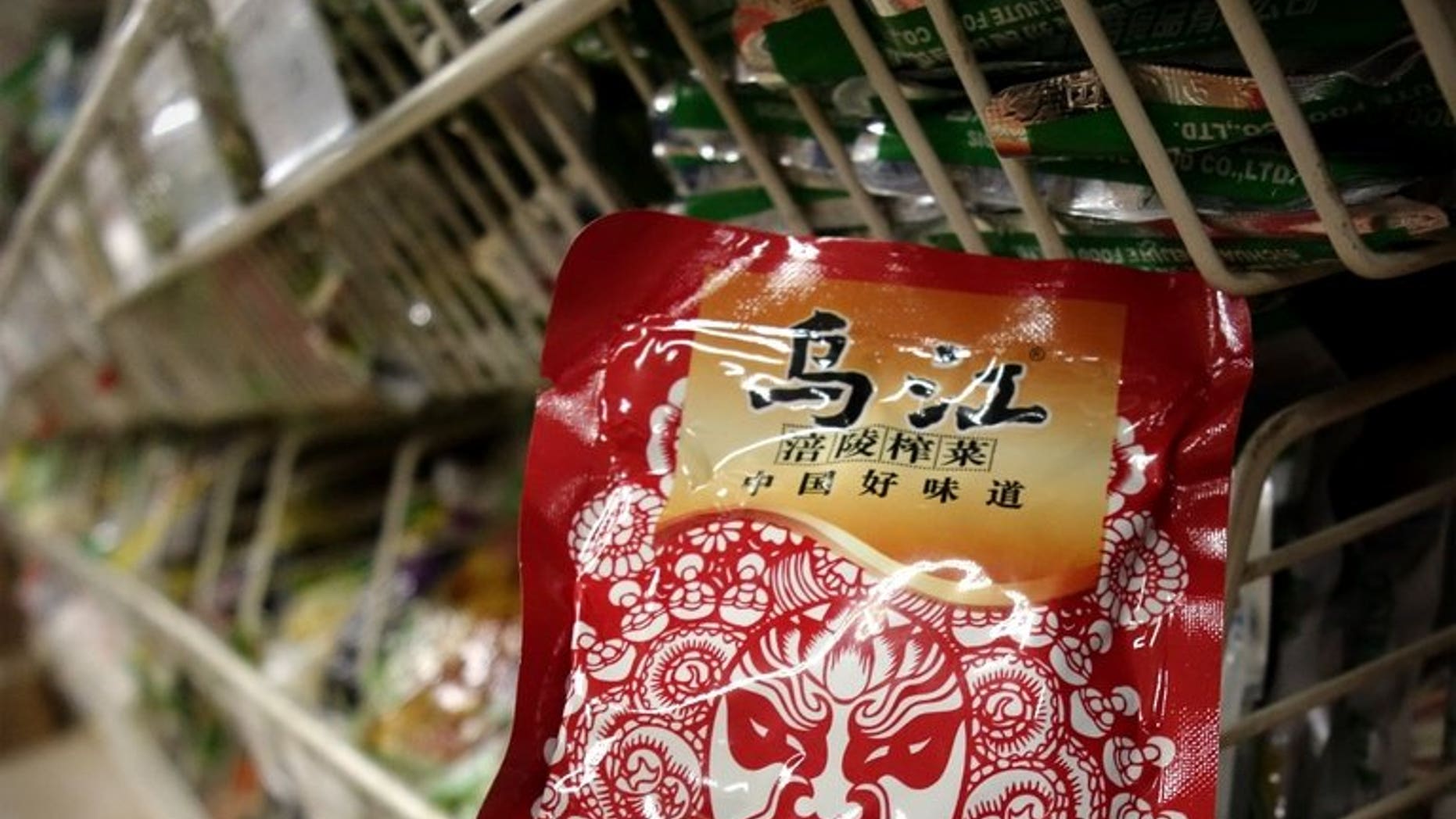 Fuling Zhacai -- pickled root vegetable -- is seen on sale at a supermarket in Beijing on August 14, 2013. Shares in a Chinese food company became one of the market's hottest stocks on Tuesday after Xi Jinping gave its spicy pickles the presidential stamp of approval.