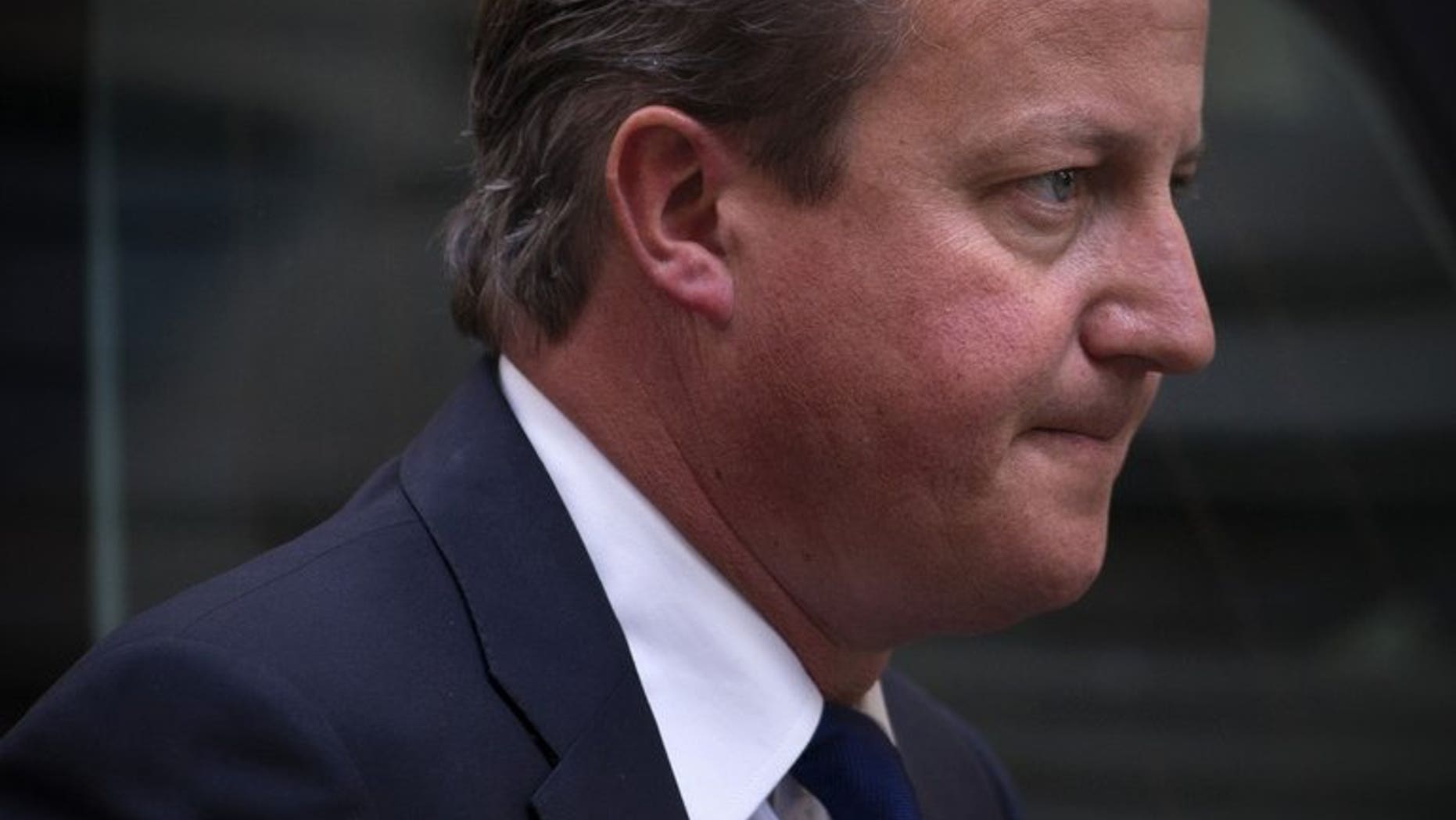 Prime Minister David Cameron arrives at 10 Downing Street in London on August 27, 2013. Britain has given a cautious welcome to a Russian proposal to prevent military strikes against the Syrian regime by destroying its chemical weapons but said Damascus must make a "serious and genuine" offer to eradicate its stocks.