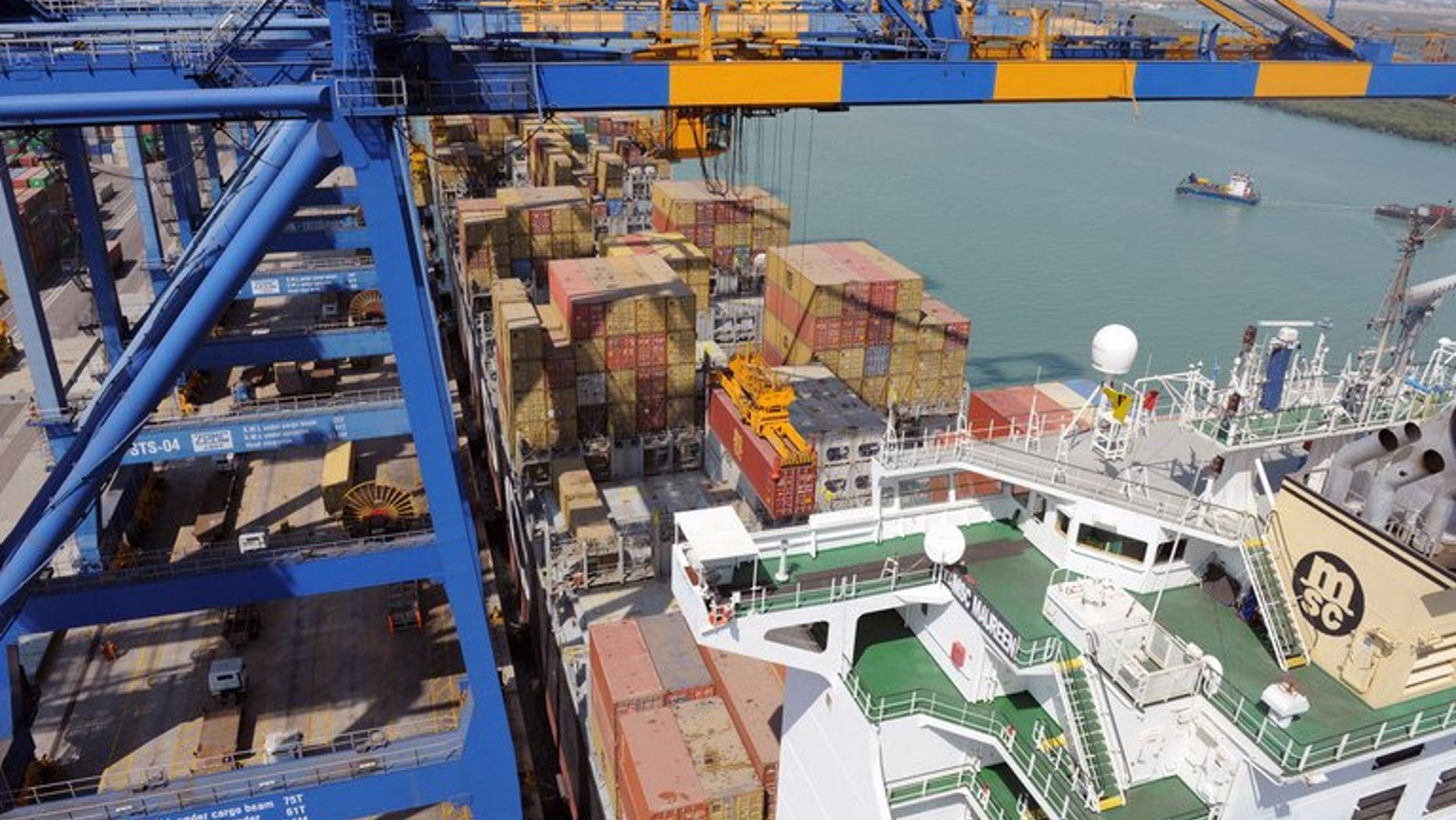 A container ship is unloaded at the Mundra Port and Special Economic Zone at Mundra on February 17, 2011.