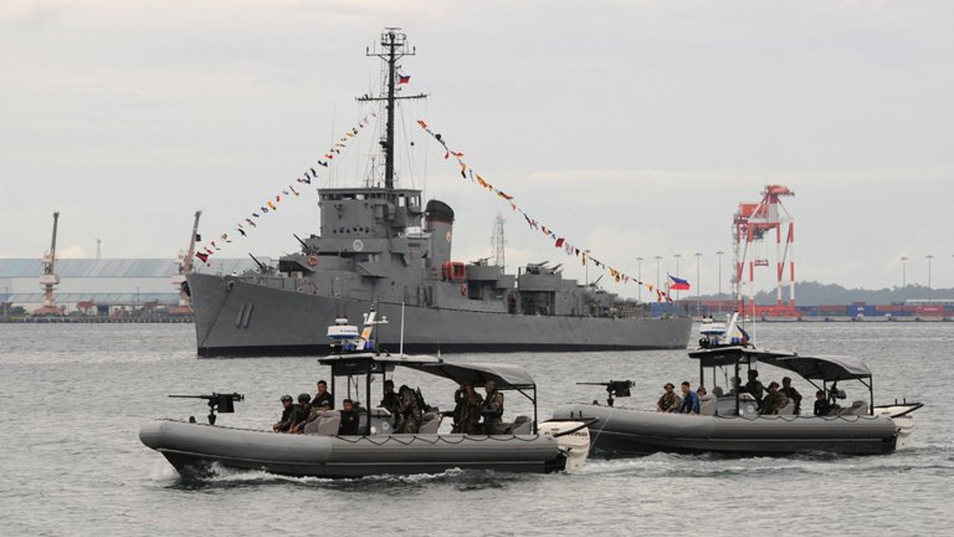 A Philippine Navy special operations group on board speed boats patrols off Subic Bay, facing the South China Sea, on August 6, 2013.