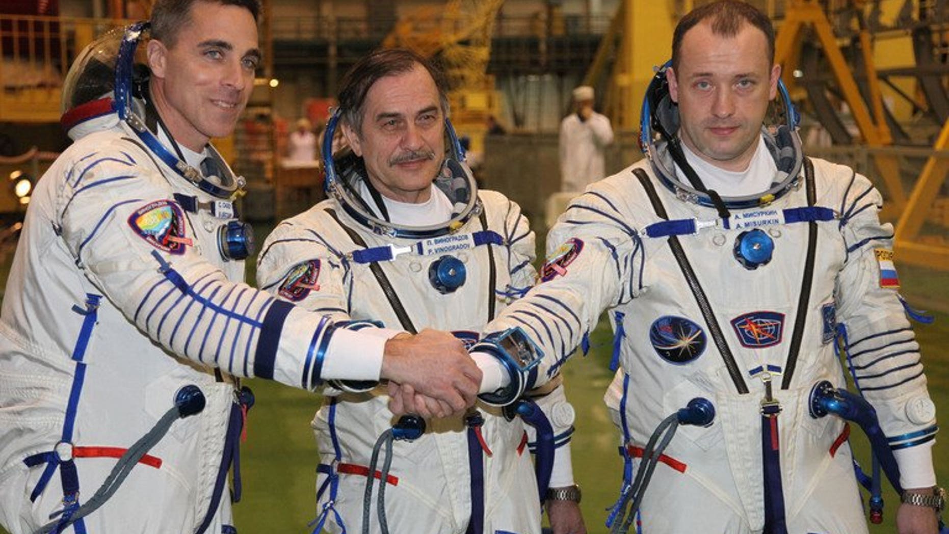 Russian cosmonauts, Pavel Vinogradov (C), Alexander Misurkin (R), and US astronaut Christopher Cassidy during training at Kazakhstan's Baikonur cosmodrome on March 17, 2013. The three returned to Earth Wednesday on board a Russian Soyuz capsule after a half-year mission on the International Space Station (ISS), landing in Kazakhstan, mission control in Moscow announced.