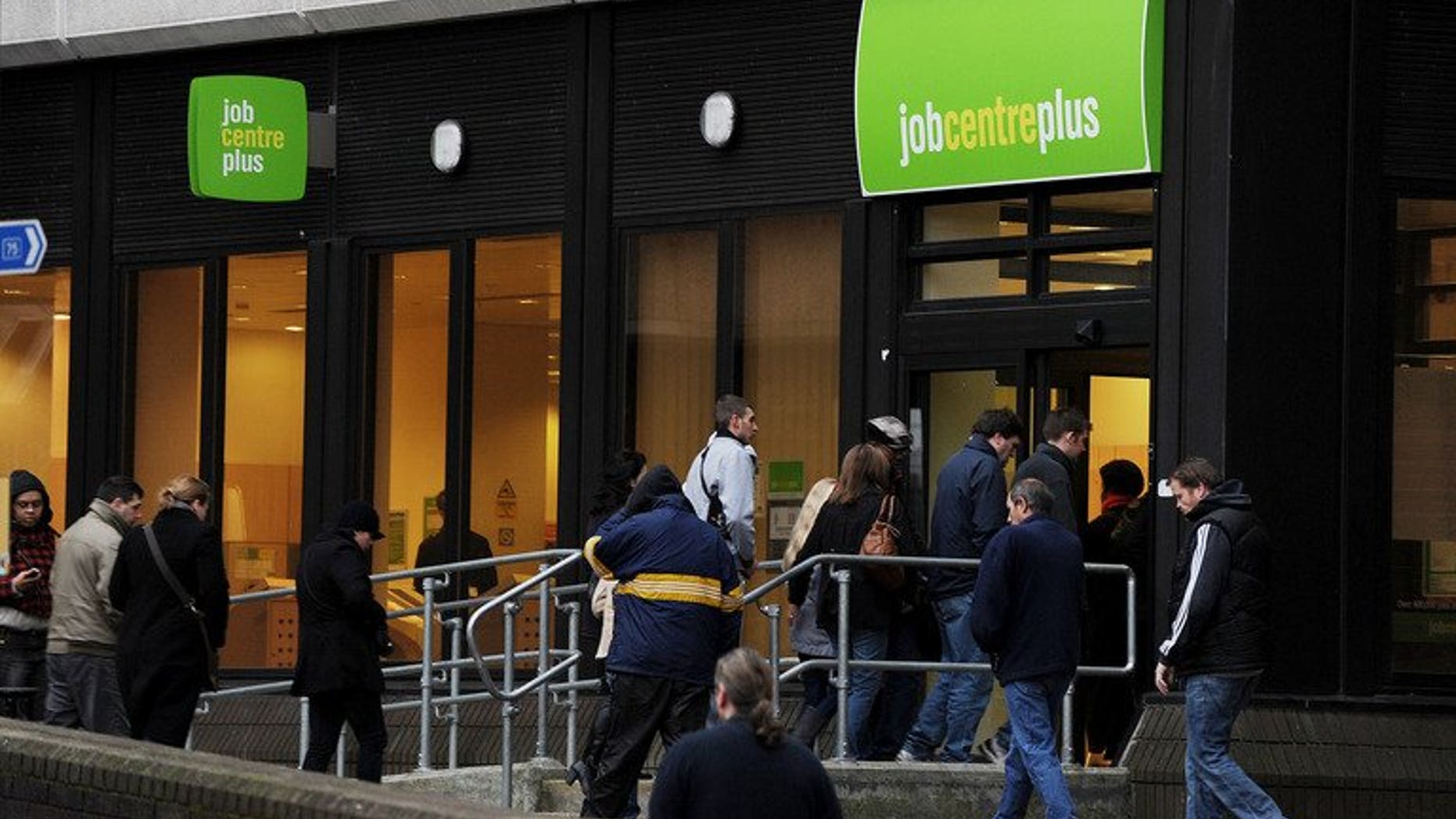 People enter a job centre in Bromley on January 20, 2010. Britain's unemployment rate eased to 7.7 percent in the three months to July, official data showed.