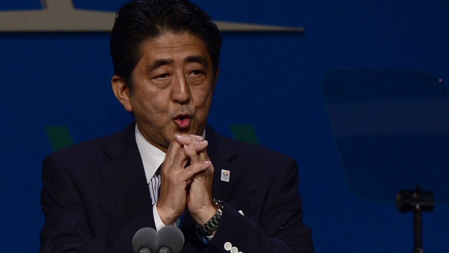 Japan's Prime Minister Shinzo Abe, pictured in Buenos Aires on September 7, 2013. Abe intends to raise sales tax to 8.0 percent next year, from the current rate of 5.0 percent.