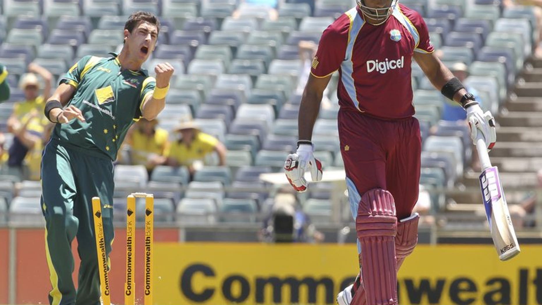 Australia's Mitchell Starc (L) celebrates during an ODI against the West Indies at the WACA ground on February 1, 2013. Perth's WACA ground will be without a Test match when India tour Australia during the 2014-15 season, Cricket Australia has announced.