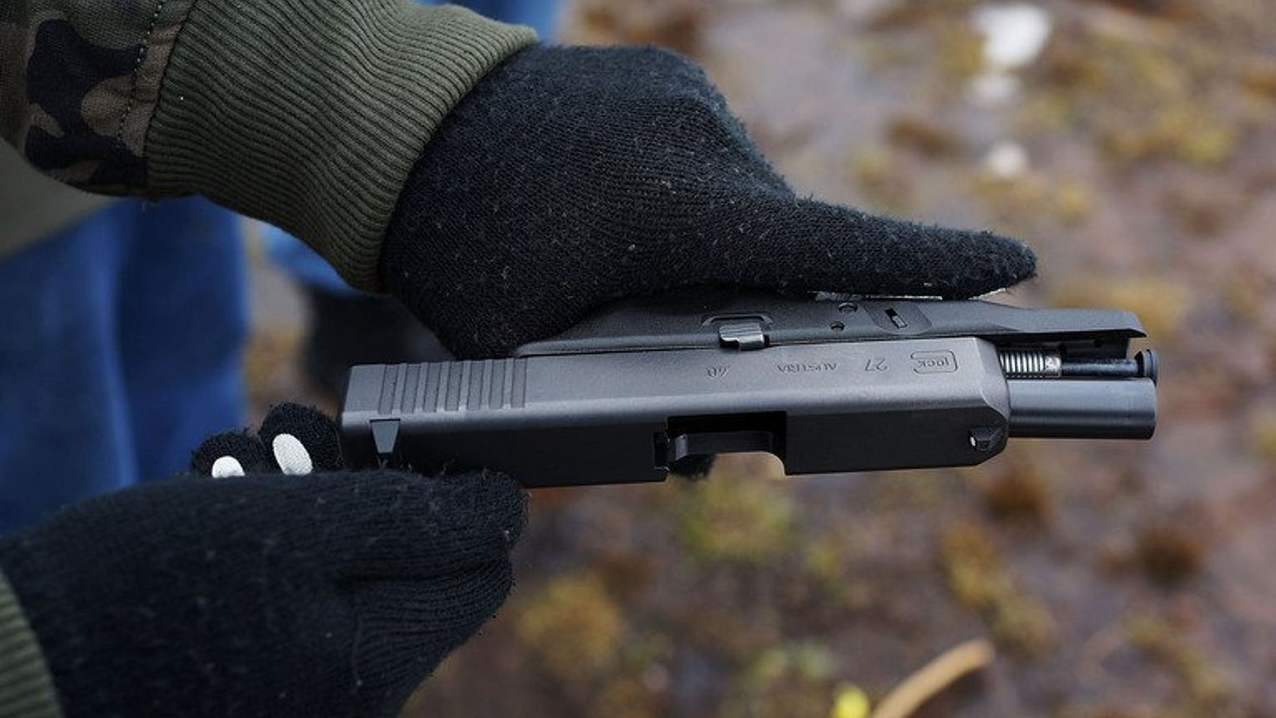 Students learn to fire their pistols at a shooting range on February 24, 2013 in Wallingford, Connecticut, US. A Kenyan woman has been spared jail for hiring hitmen kill her husband after the couple promised a judge that they had patched up their differences, reports said Friday.