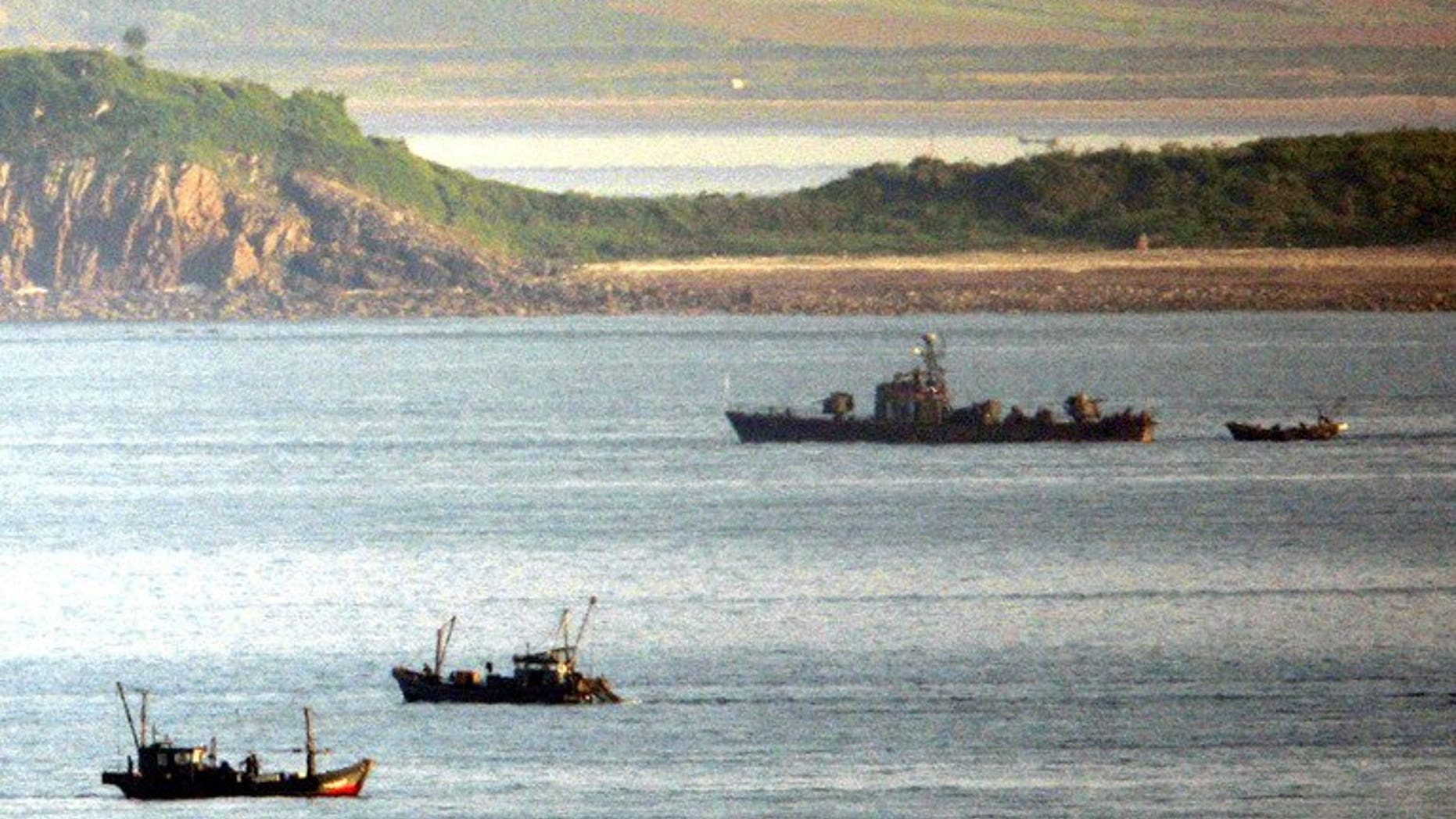 A North Korean navy patrol boat is seen amongst fishing boats close to Yeonpyeong island in disputed waters of the Yellow Sea, on May 31, 2009. A South Korean man has escaped four decades after he was kidnapped by North Korea while fishing near the disputed Yellow Sea border.