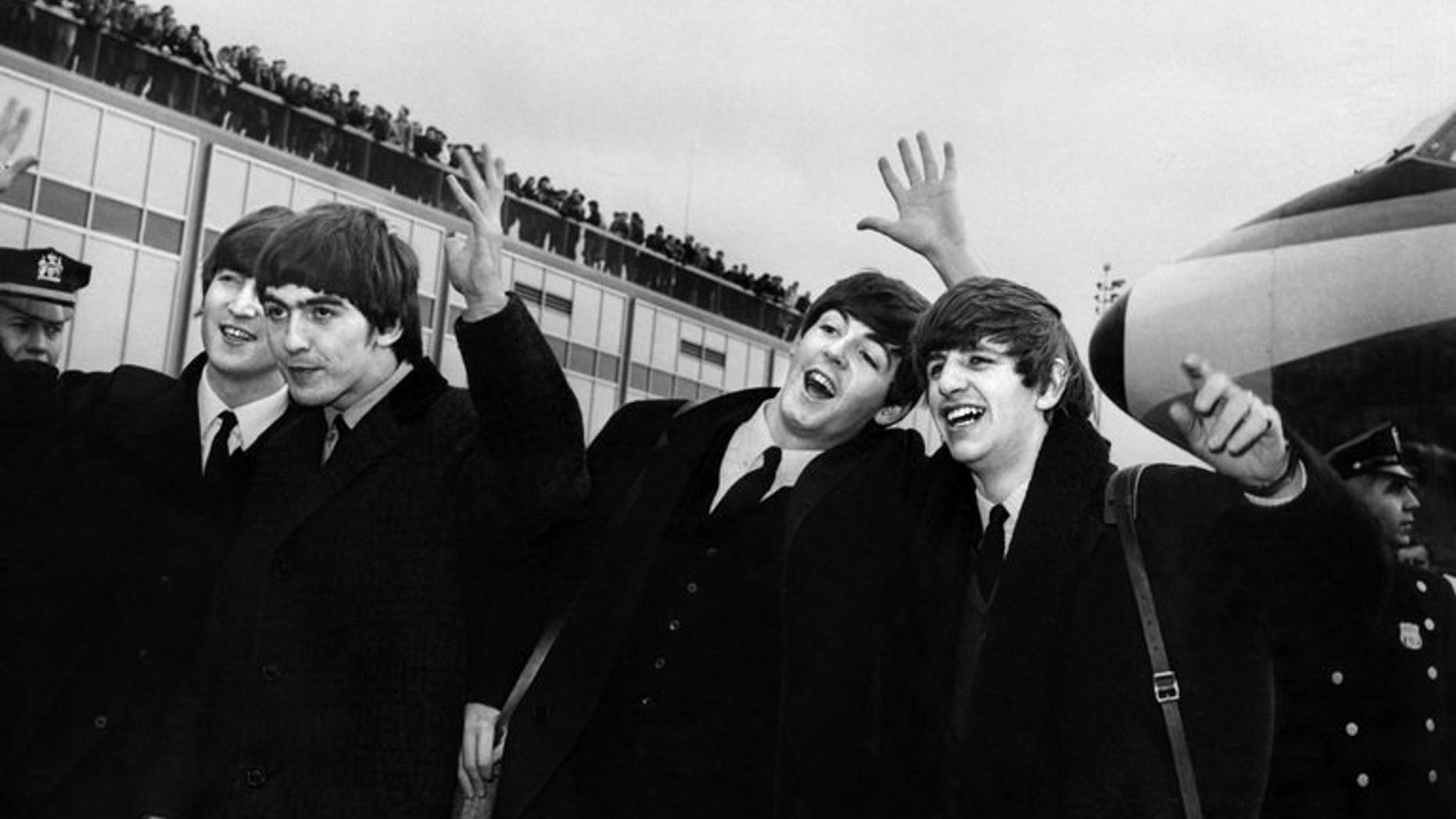 The Beatles -- from left to right, John Lennon, Ringo Starr, Paul McCartney and George Harrison -- arrive at John F. Kennedy Airport in New York on February 7, 1964. A box set of previously unreleased recordings and studio chat by The Beatles including early hits and cover versions is to be released later this year, their record company said Friday.