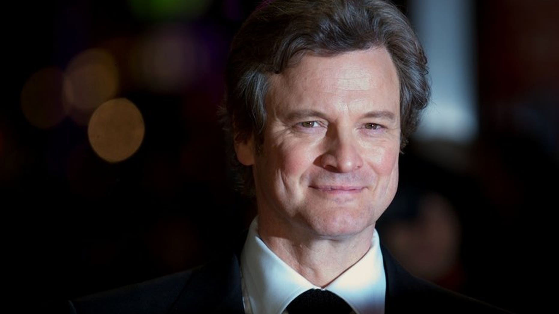 British actor Colin Firth poses on the red carpet as he arrives to attend the premiere of 'Gambit' in Leicester Square, London, on November 7, 2012. The King's Speech star Colin Firth is to voice Paddington Bear in a Hollywood film about the adventures of the duffle-coat-wearing Peruvian, media reports said on Friday.