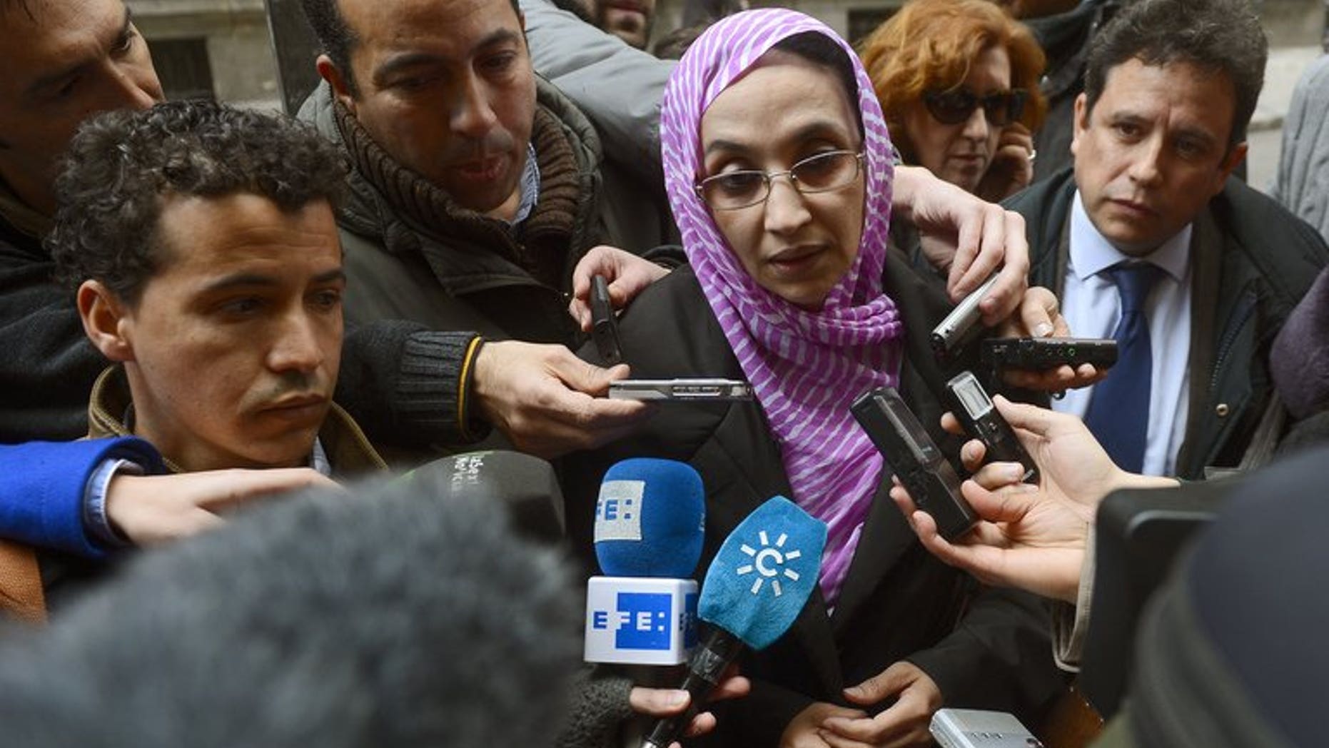 Sahrawi human rights activist Aminatou Haidar speaks to the media as she leaves the High Court in Madrid on March 13, 2013.