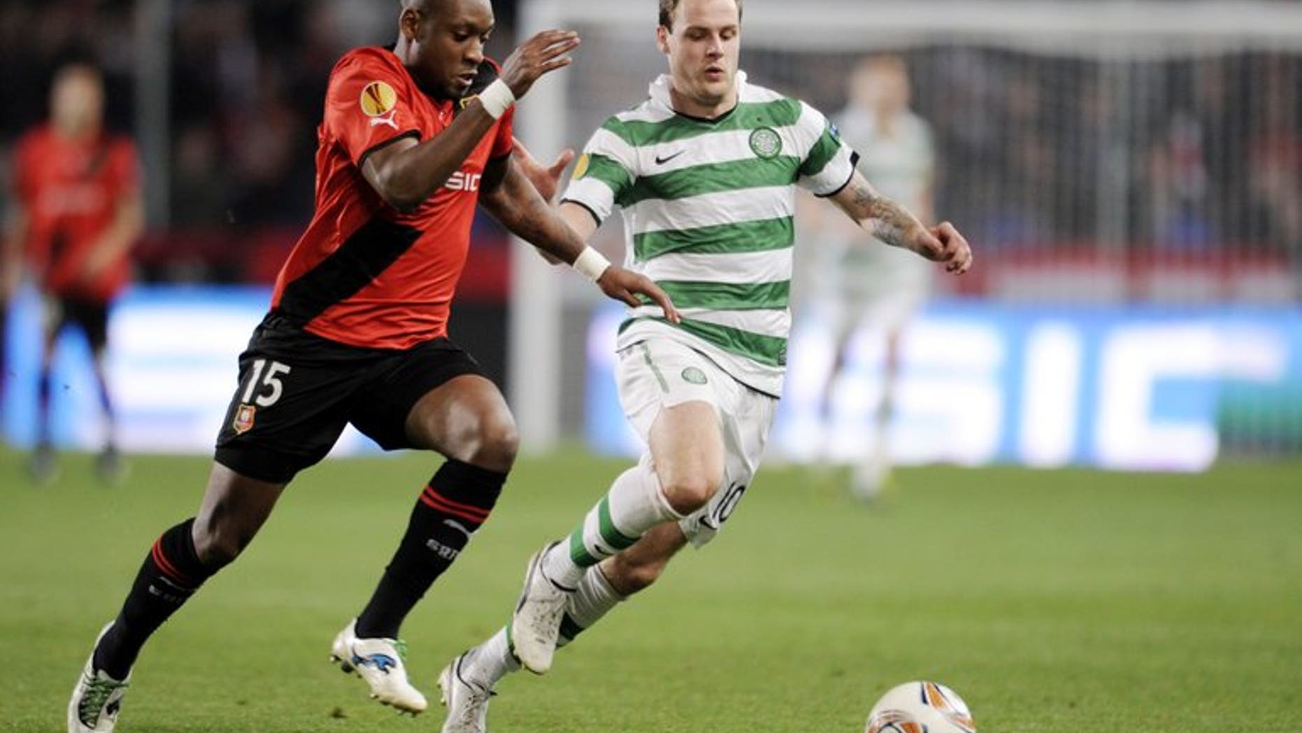Celtic striker Anthony Stokes (R) and Rennes' Jean Armel Kana Biyik during a Europa League football match in western France on October 20, 2011.
