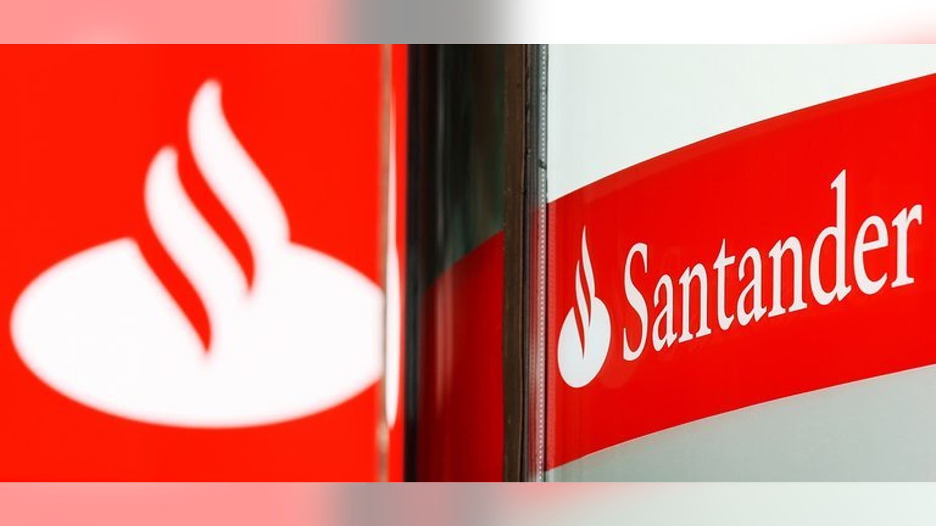 British police said they have charged four men over a plot to remotely take control of a computer at a branch of Santander bank and steal millions of pounds