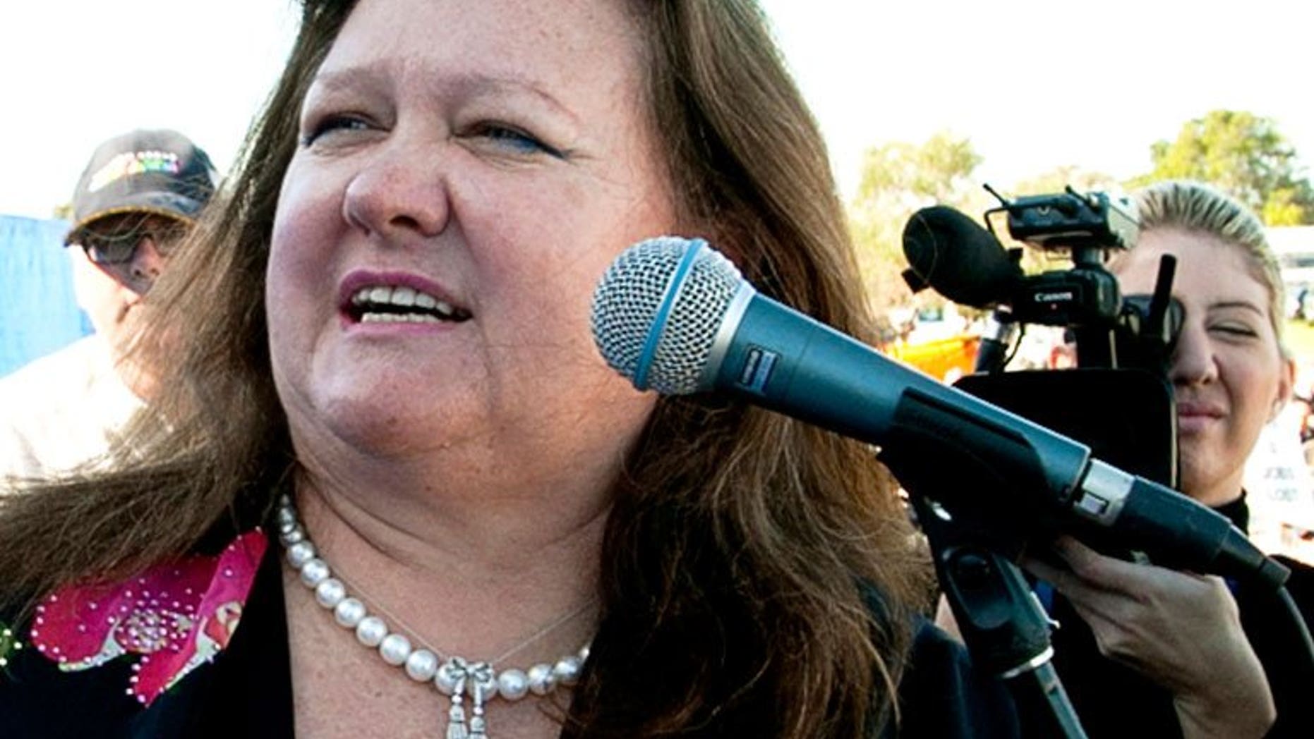 Australia's richest person Gina Rinehart speaks during a rally in Perth on June 9, 2010. The world's richest woman Gina Rinehart is believed to have increased her holding in Australian media group Fairfax to more than 15 percent, reports said on June 15.??AFP PHOTO / Tony ASHBY