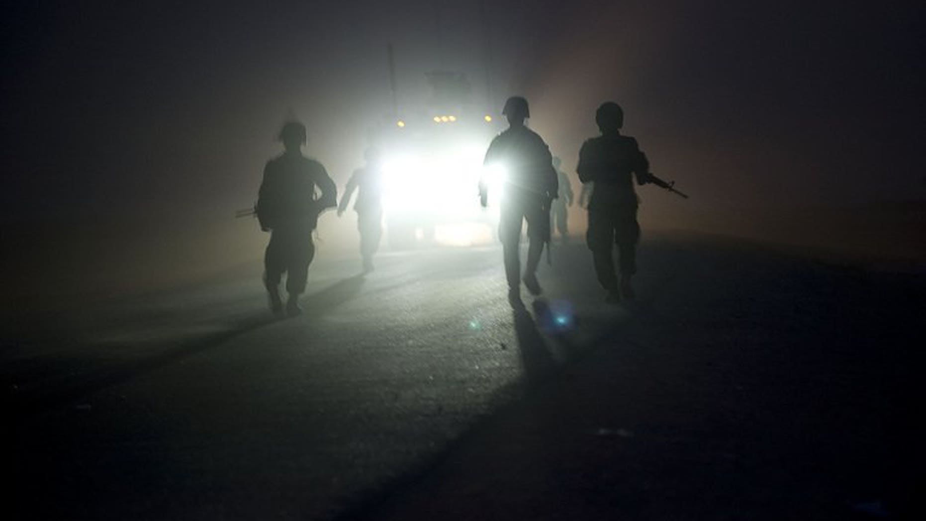 Soldiers operating under NATO command pictured during a patrol near the Morghan-Khecha village in Daman district, Afghanistan's Kandahar province, on September 8, 2012.