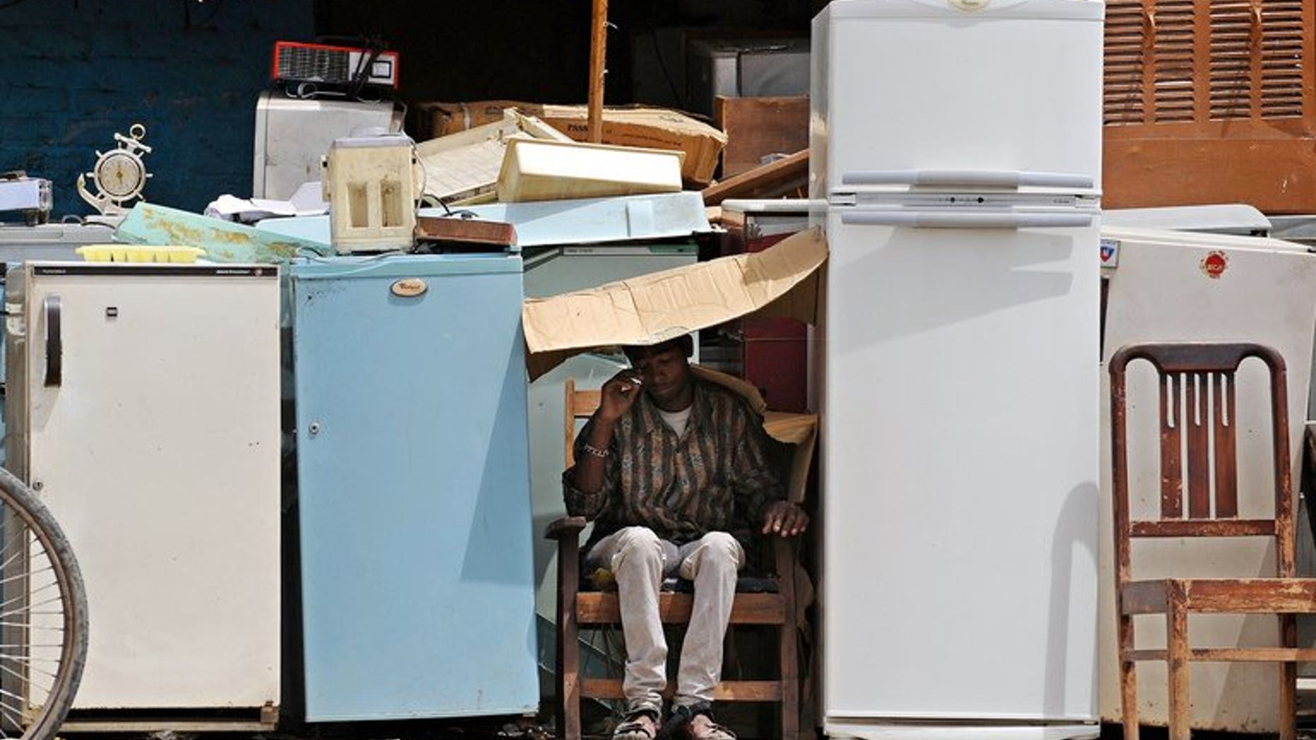 Used refrigerators are displayed for sale. Three South African children were found dead by a grandparent after becoming stuck in an abandoned refrigerator as they played near their home, police have said.