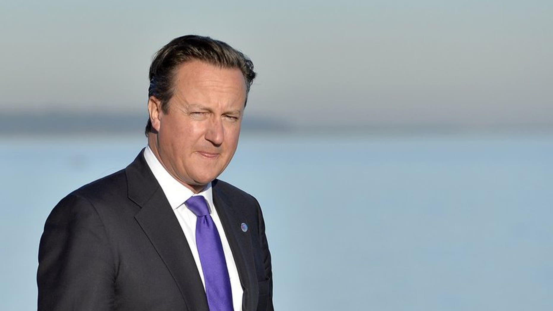 British Prime Minister David Cameron is pictured walking at the G20 site in Saint Petersburg on September 6, 2013.