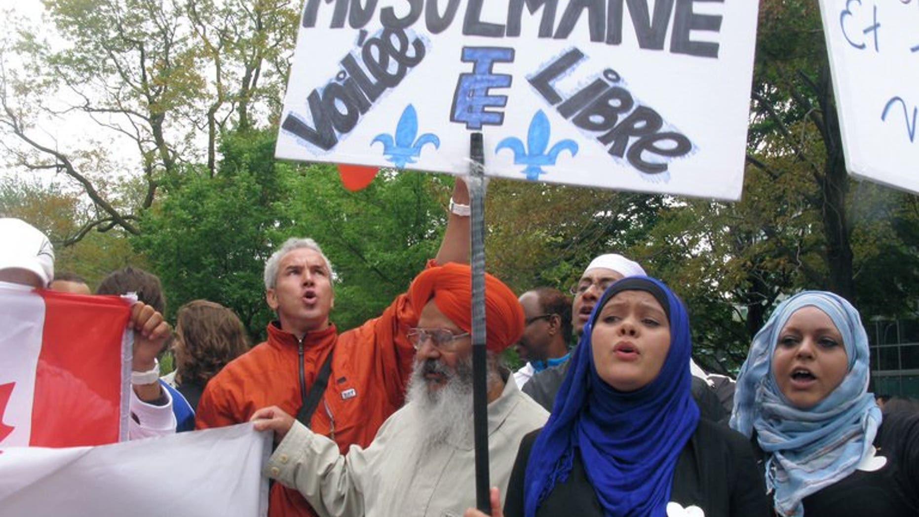 People demonstrate in Montreal against a Quebec government plan to ban "conspicuous" religious symbols in public buildings or worn by public employees on September 14, 2013.