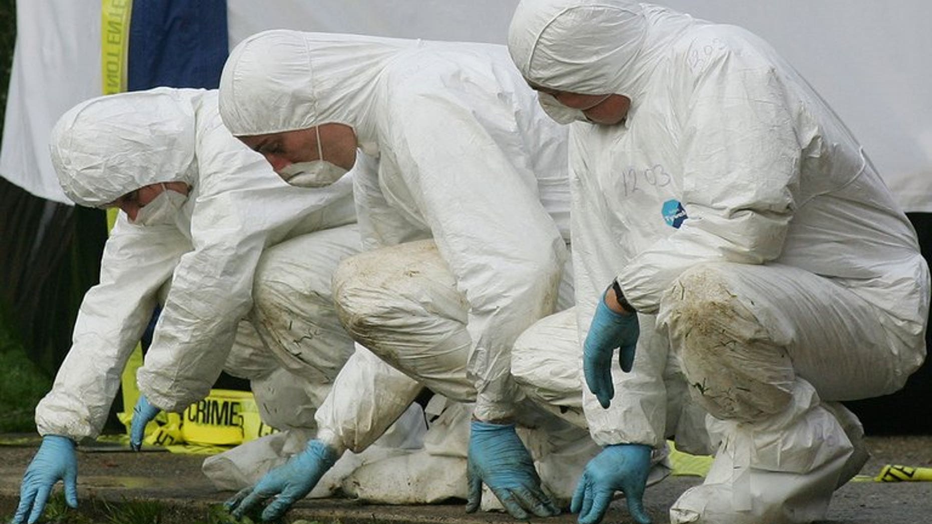 File picture for illustration only shows police forensic officers at a crime scene. A man who lost his whole family in a fire at their home in Leicester spoke of his pain as police arrested five people in relation to the blaze.