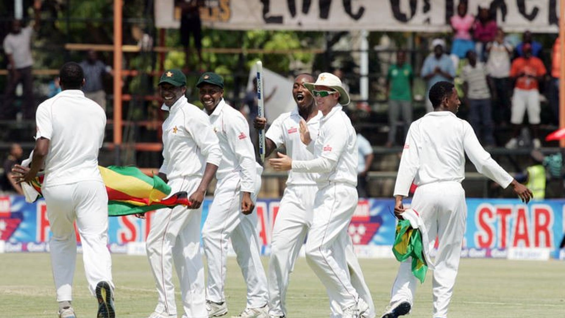 Zimbabwe players celebrate victory over Pakistan on September 14, 2013 during the fifth day of the second Test against at the Harare Sports Club. Former Pakistan cricket greats and fans have demanded a new national team captain and coach after an embarrassing defeat against minnows Zimbabwe.