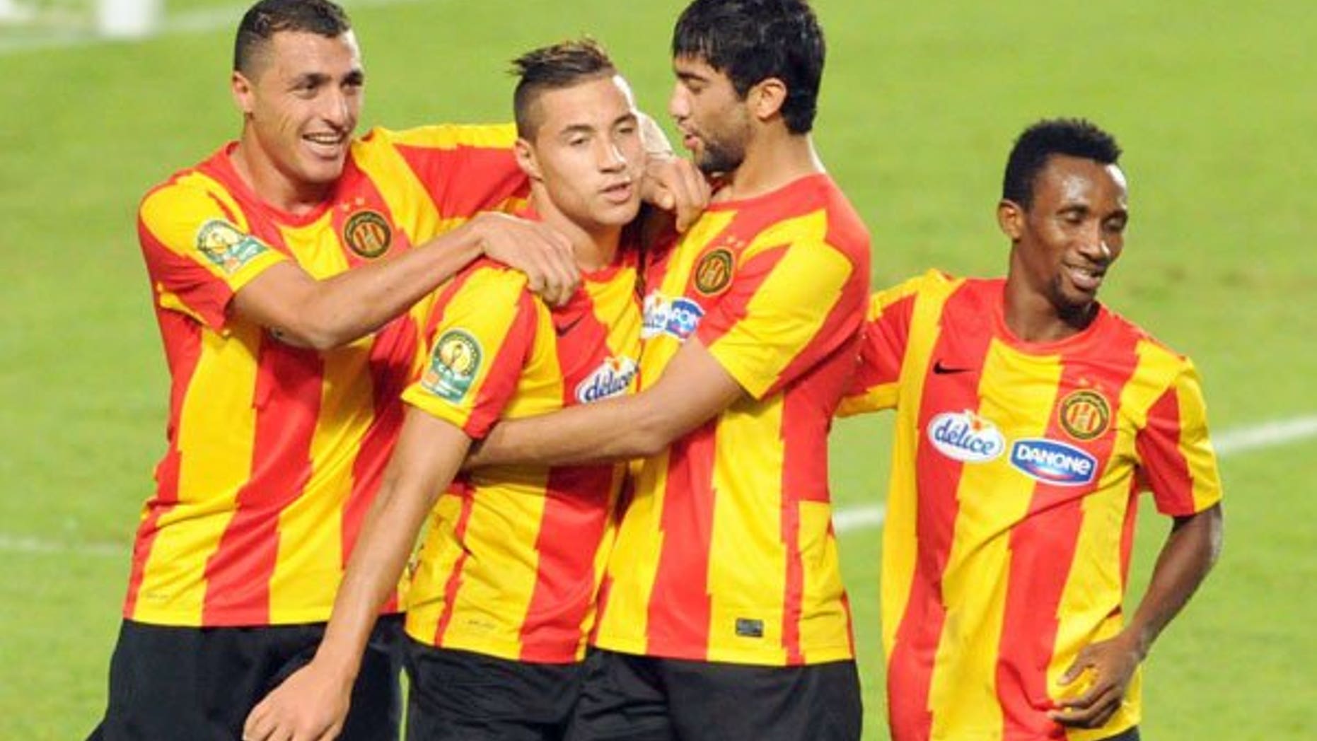 Esperance de Tunis striker Youssef Blaili celebrates with his teammates during their CAF Champions League football Group A match on August 3, 2013 near Tunis. The Tunis team have secured semi-final place in the tournament.