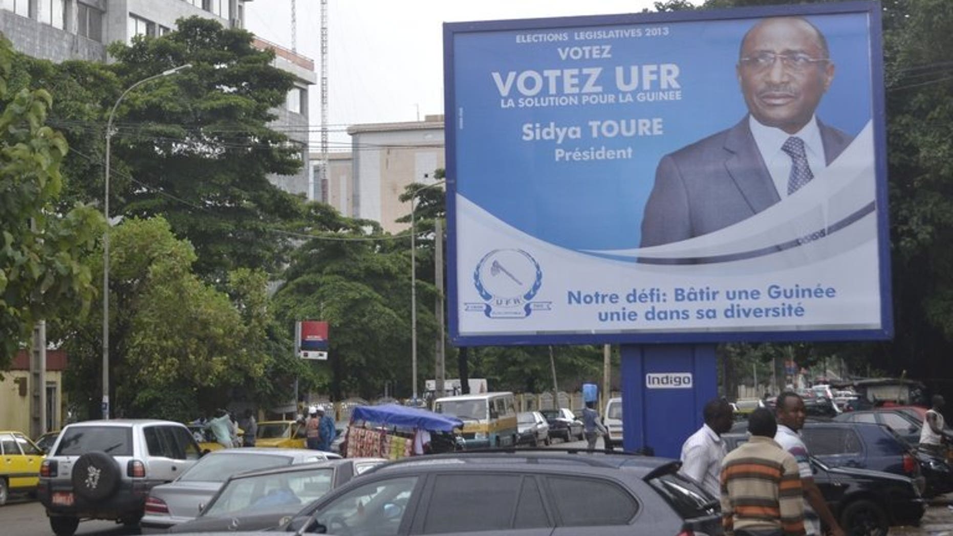 A board shows Union of Republican Force candidate Sidya Toure in Conakry, Guinea on August 31, 2013. Guinea's opposition has warned of nationwide protests if the electoral commission failed to meet its demands meant to ensure that polls due later this month are free and fair.