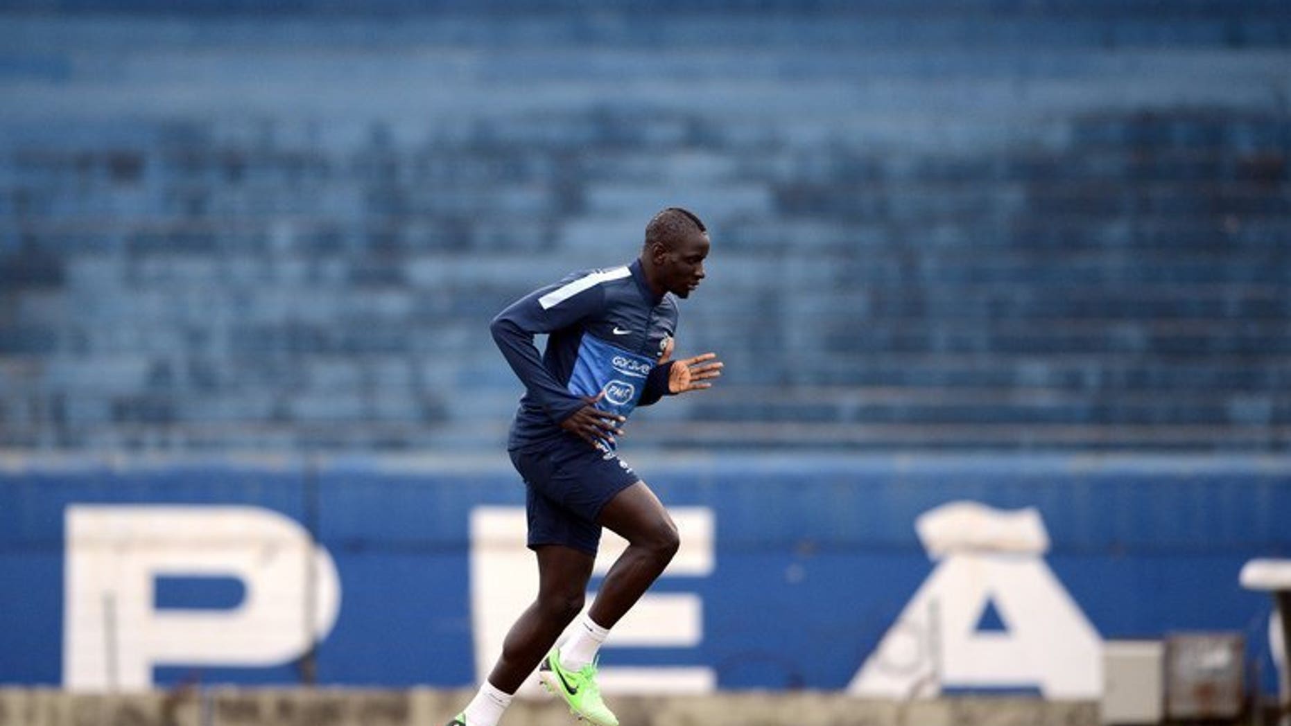 French international defender Mamadou Sakho runs during a training session at the Gremio Stadium in Porto Alegre, Brazil, on June 6, 2013. Sakho, who could make his Liverpool debut at Swansea City on Monday, hopes to repair a career that began to unravel on a wintry night in northwest France in January 2012.