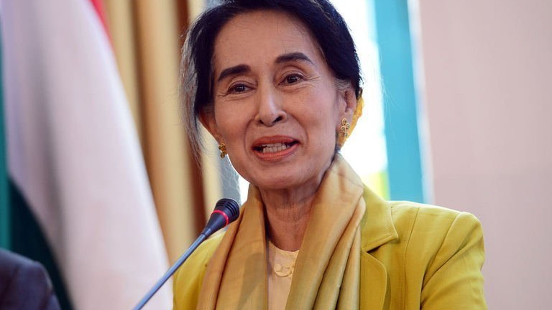 Myanmar's opposition leader Aung San Suu Kyi answers a question during a press conference in Budapest, on September 13, 2013. Suu Kyi has risked prompting Chinese anger after it was confirmed she had a private meeting with the Dalai Lama on the sidelines of a Prague rights conference.