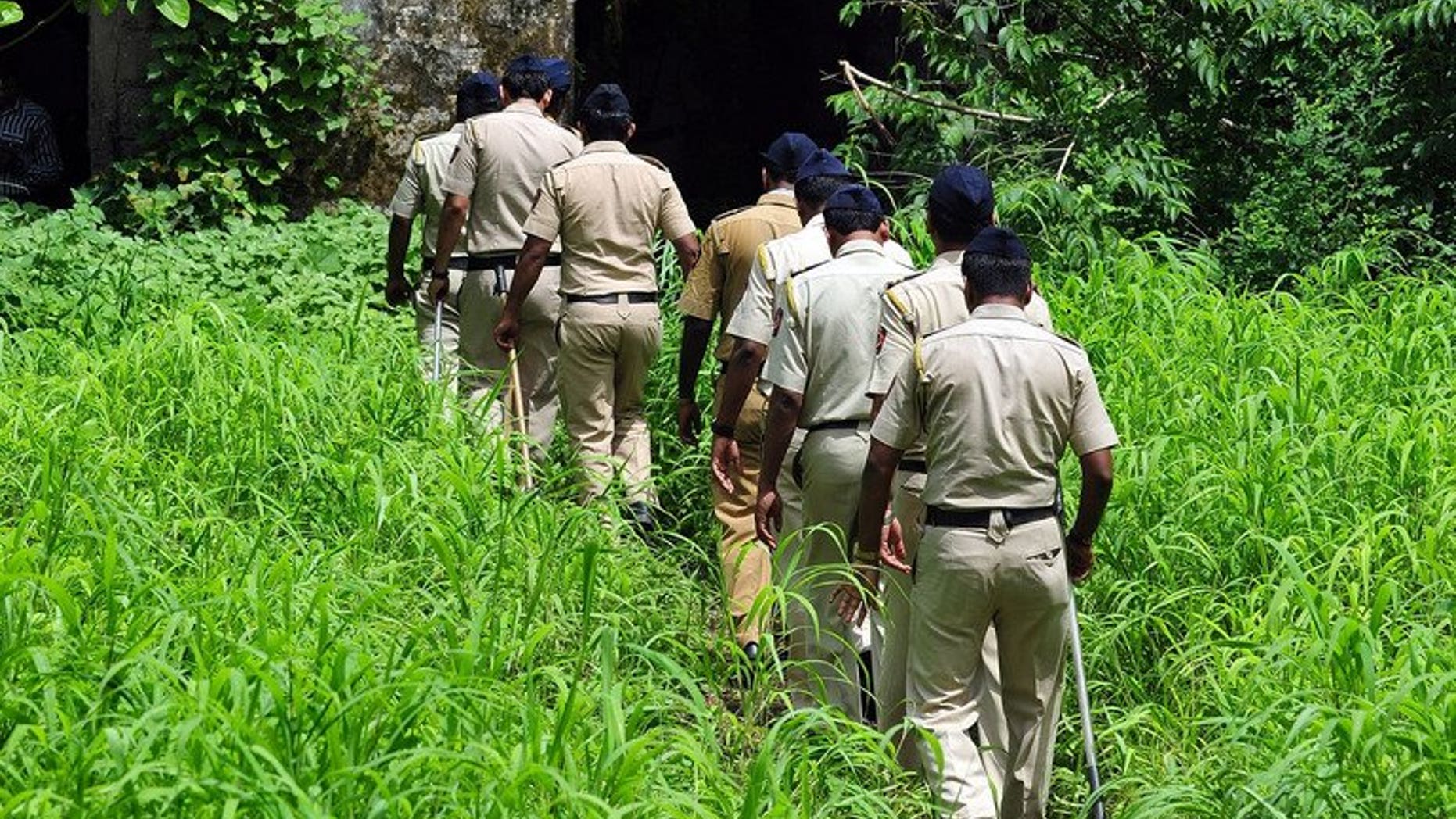 Indian policemen on patrol in Mumbai, on August 28, 2013. Indian police are interrogating a school bus cleaner after his arrest on suspicion of raping a four-year-old in the vehicle on the outskirts of Mumbai earlier this month.