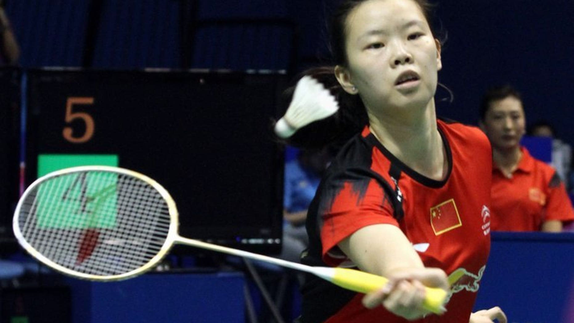 World number-one Li Xuerui, shown September 14, 2013, has pulled out of the badminton Japan Open because of a sore knee, with her teammate linking the problem to a jam-packed schedule for Chinese players.