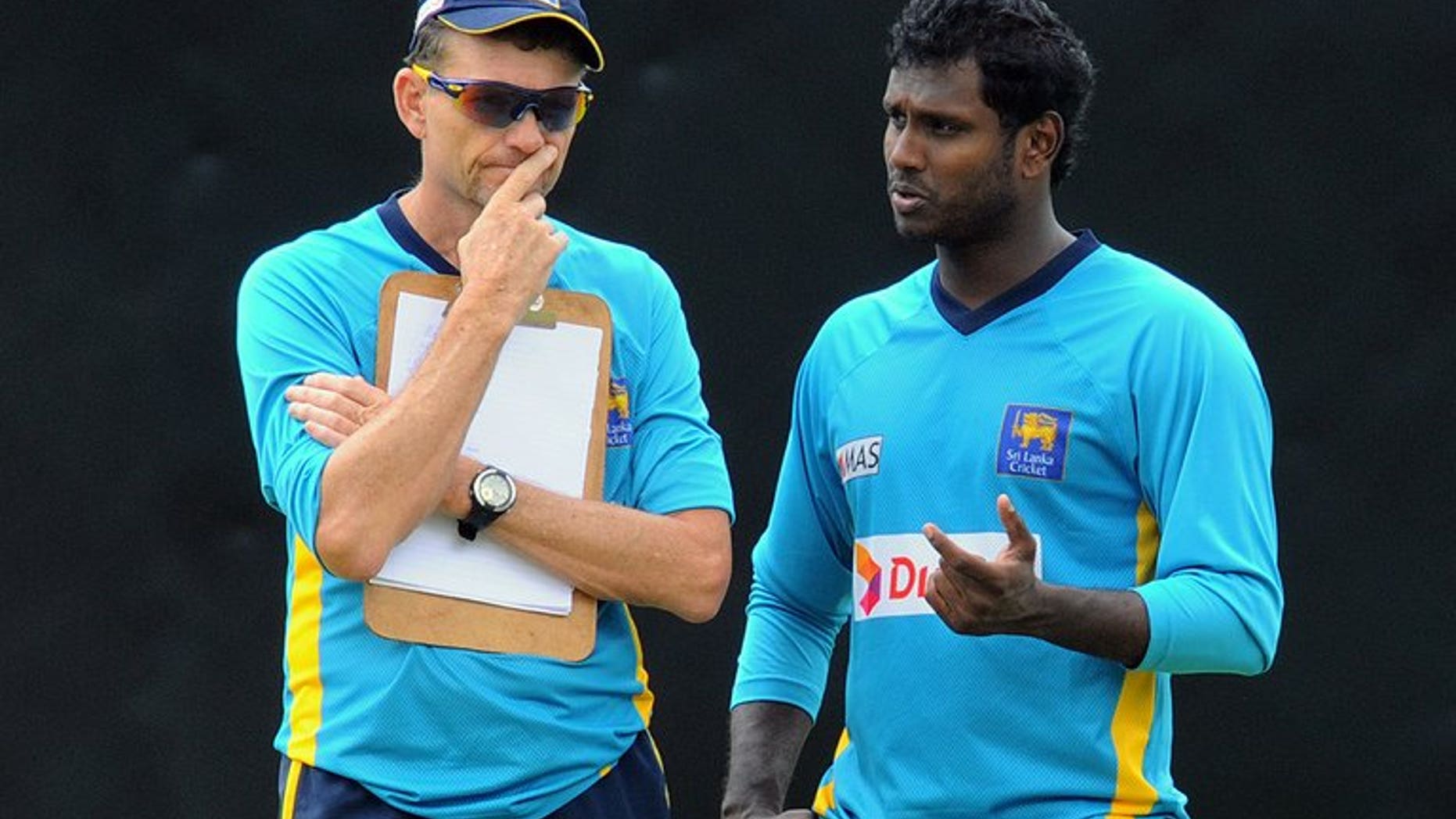 Sri Lankan captain Angelo Mathews (right) speaks with Graham Ford in Pallekele in July. Sri Lanka will seek a new coach after South African Graham Ford declined to extend his two-year term beyond January, cricket officials said on Wednesday.