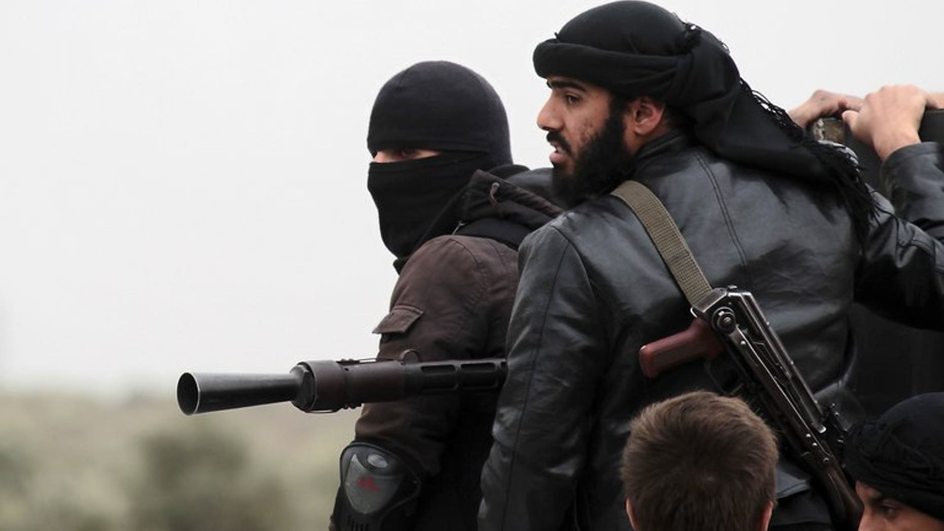 Fighters with the Al-Qaeda-linked Al-Nusra Front in the Syrian village of Aziza, on April 4, 2013. A military tribunal in Jordan has jailed six Muslim extremists for trying to join the Al-Nusra Front to fight against Syrian President Bashar al-Assad's forces.