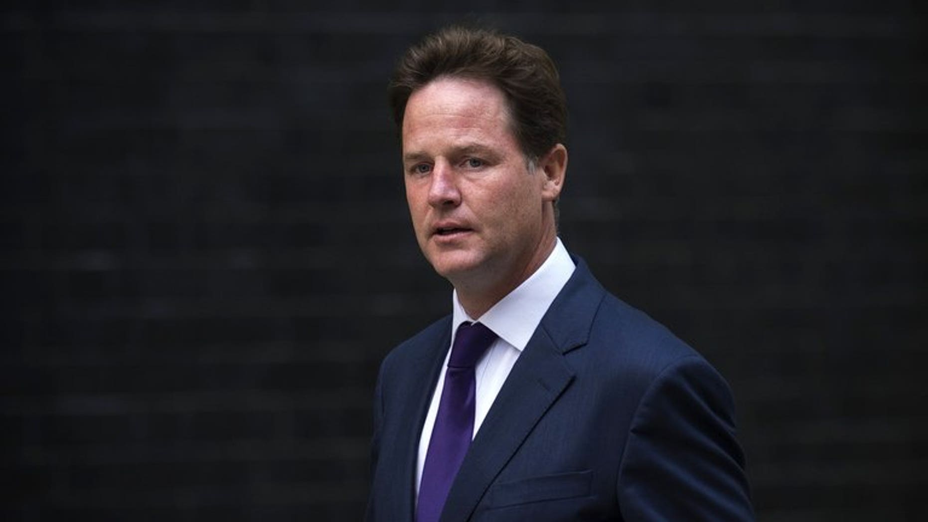 British Deputy Prime Minister Nick Clegg arrives at 10 Downing Street in central London on August 27, 2013.