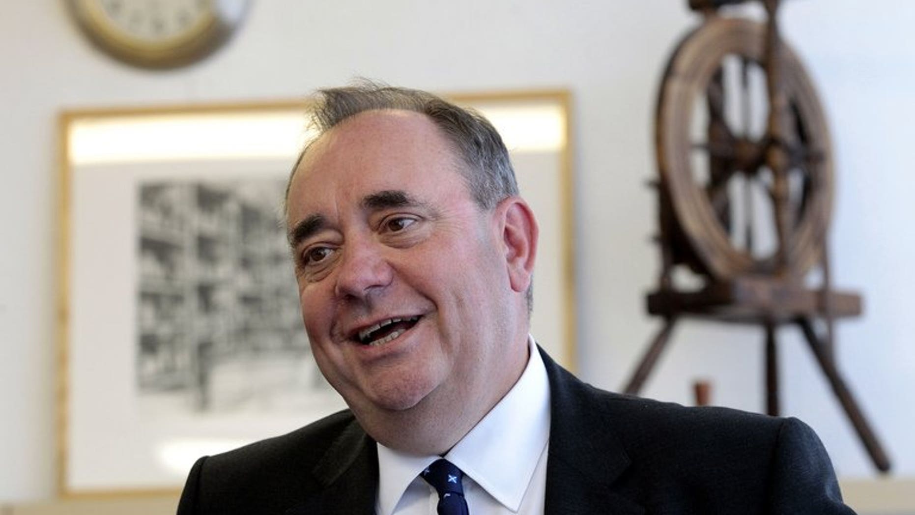 Alex Salmond, Scotland's leader of the Scottish National Party (SNP) and first minister, visits the Barrie Knitwear factory in Hawick, Scotland, on August 20, 2013.