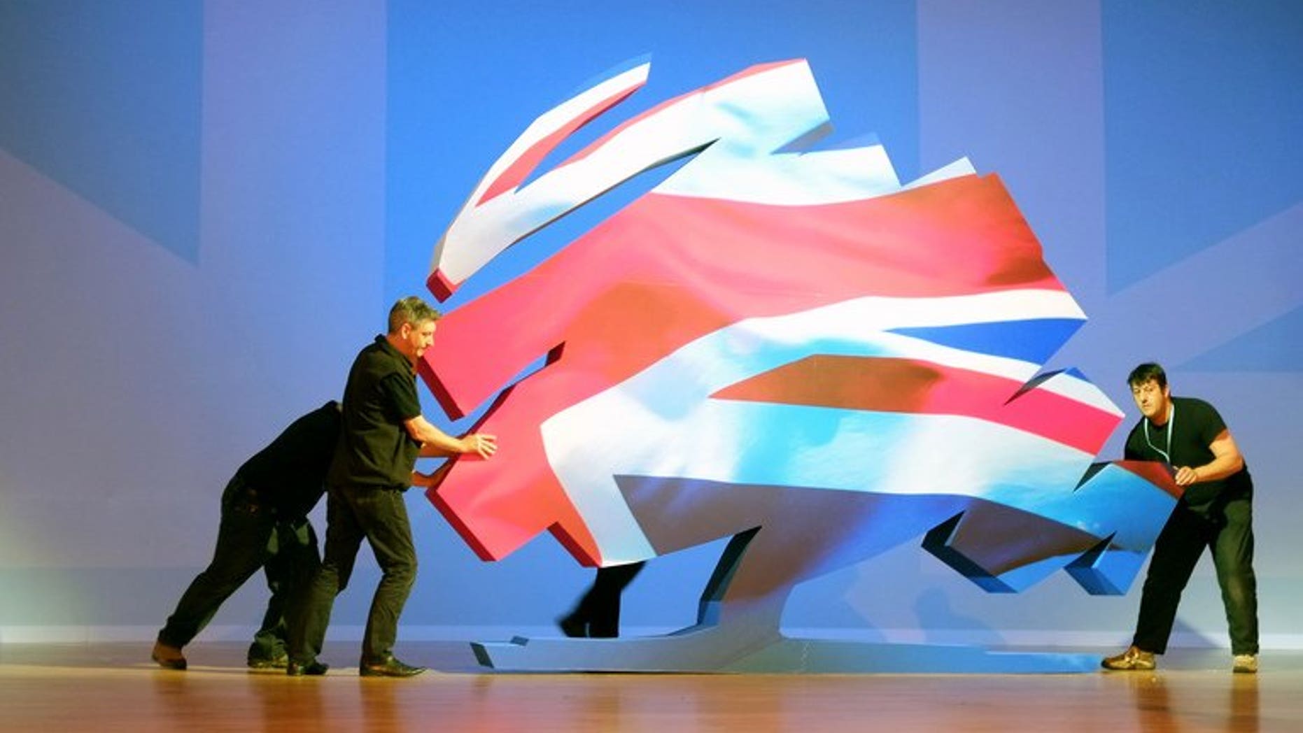 The Conservatives have drawn level with Labour, wiping out a 14 point deficit in a year, according to a survey published in Thursday's Sun. File picture shows the Conservative Party logo being set up on the final day of the 2012 Conservative Party Conference.