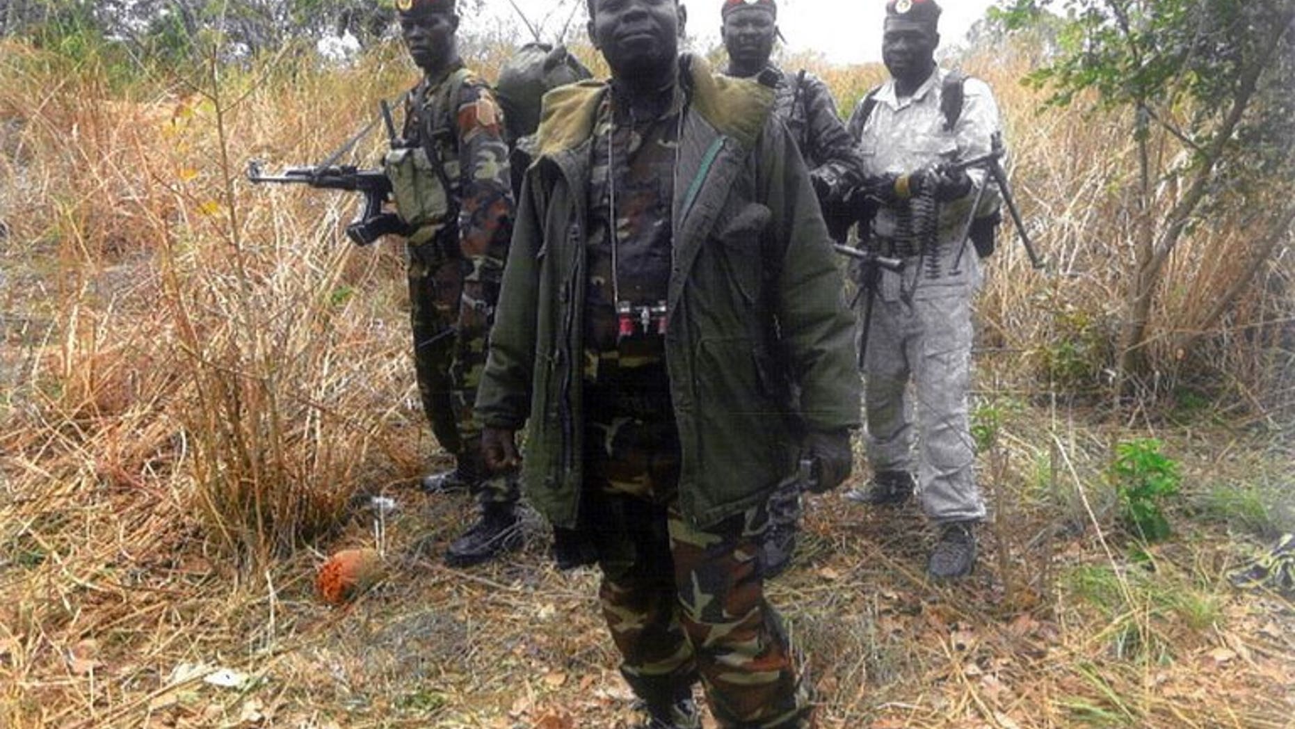 An undated handout photo released by the Central African People's Democratic Front (FDPC) shows their leader Abdoulaye Miskine standing with fighters in Biti. Police in Cameroon have arrested a rebel leader from neighbouring Central African Republic, Miskine, suspecting that he might launch cross-border raids.