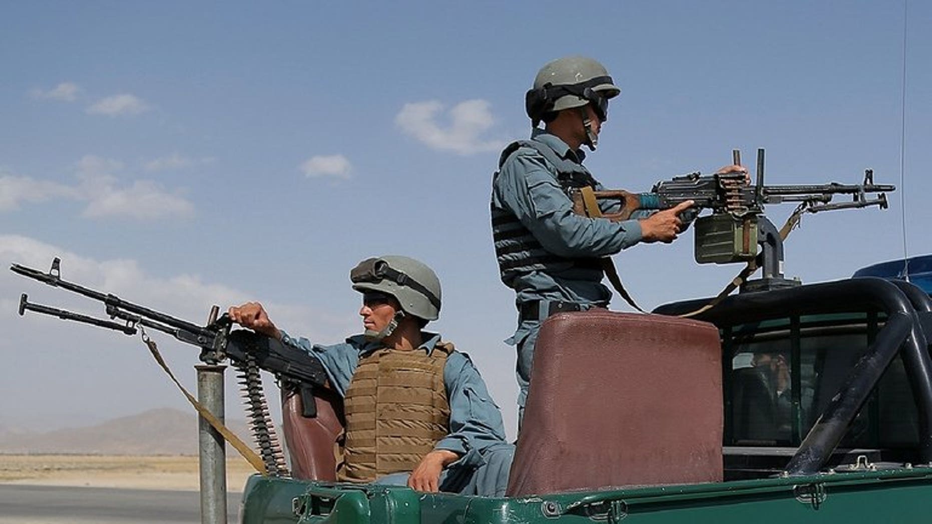 Afghan policemen keep watch at a checkpoint in Ghazni on August 14, 2013. A former Afghan lawmaker and district governor said Thursday he had defected to the Taliban as the Islamist hardliners seek to strengthen their influence before US-led combat troops withdraw next year.