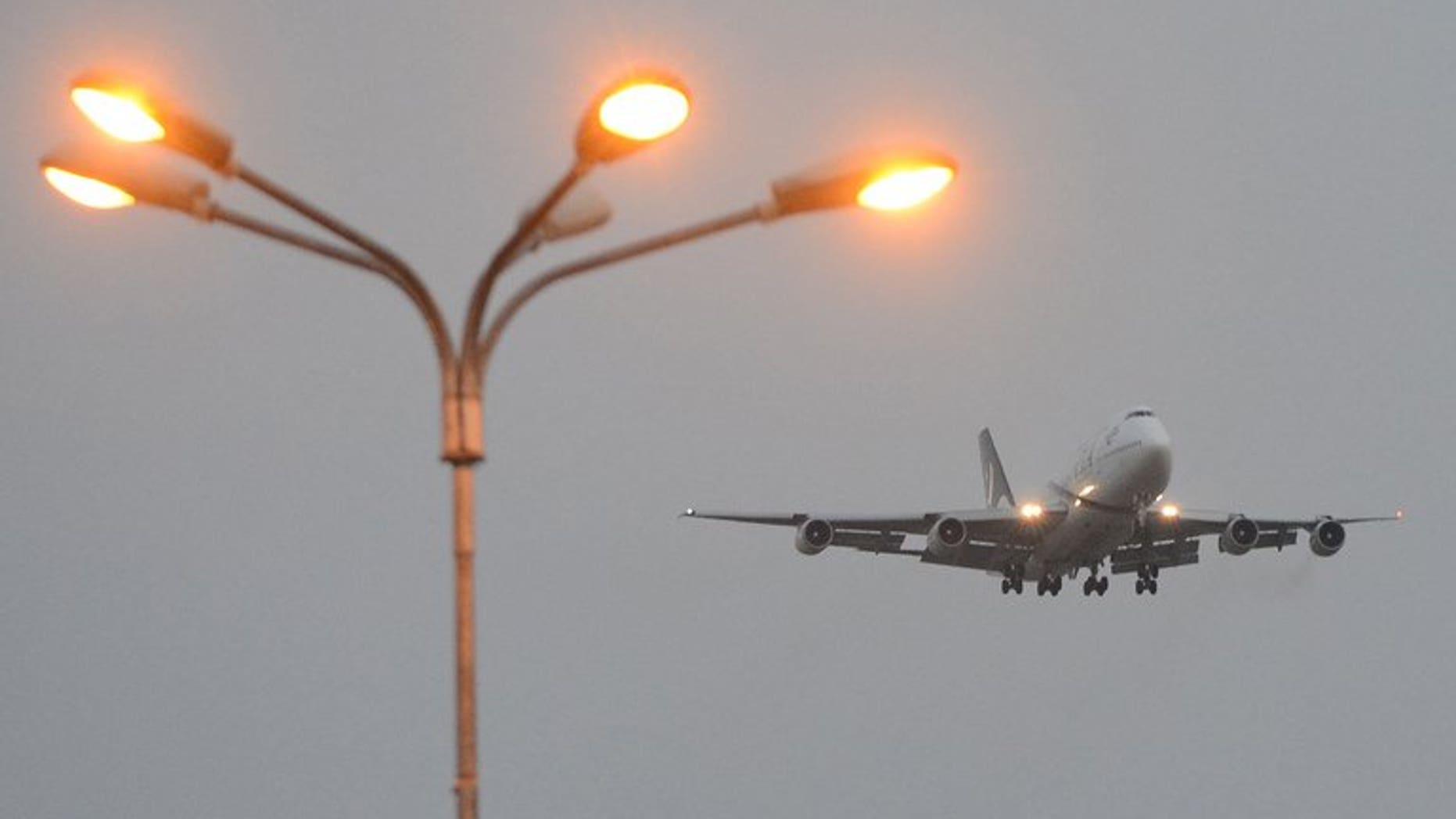 A Pakistan International Airlines (PIA) plane prepares to land in Islamabad on September 13, 2013. A pilot believed to be working for the airline has been arrested at a British airport on suspicion of being drunk in charge of a plane, police said.
