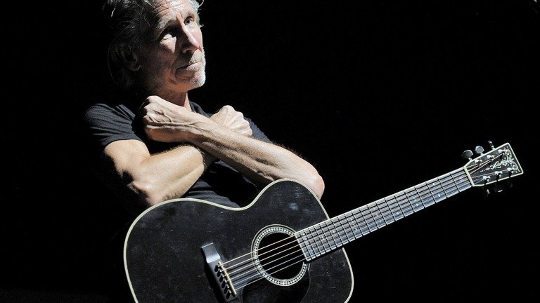 British singer Roger Waters performs during his 'The Wall' tour at the Esprit Arena in Duesseldorf, Germany, on September 6, 2013.