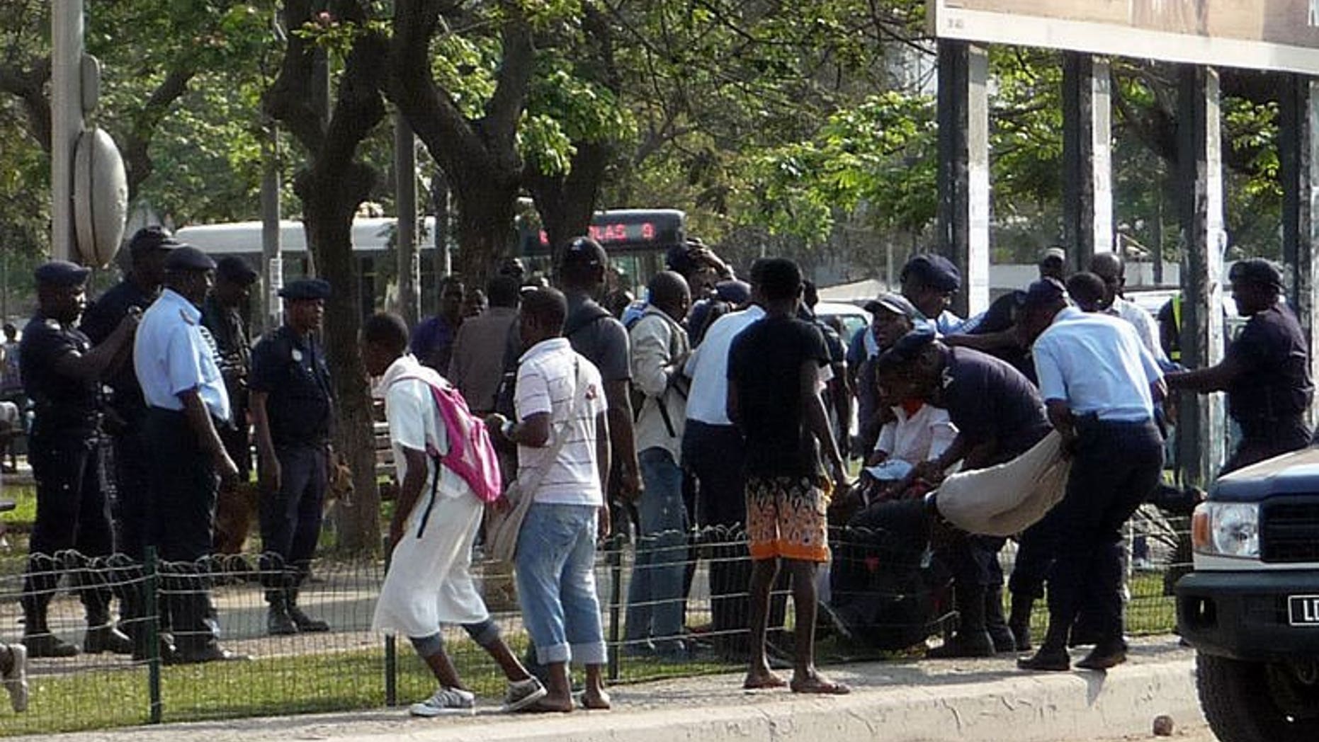 Angolan police officers arrest young protesters on September 19, 2013 at the Square of Independance in the center of Luanda while they were calling for a demonstration against social injustices.