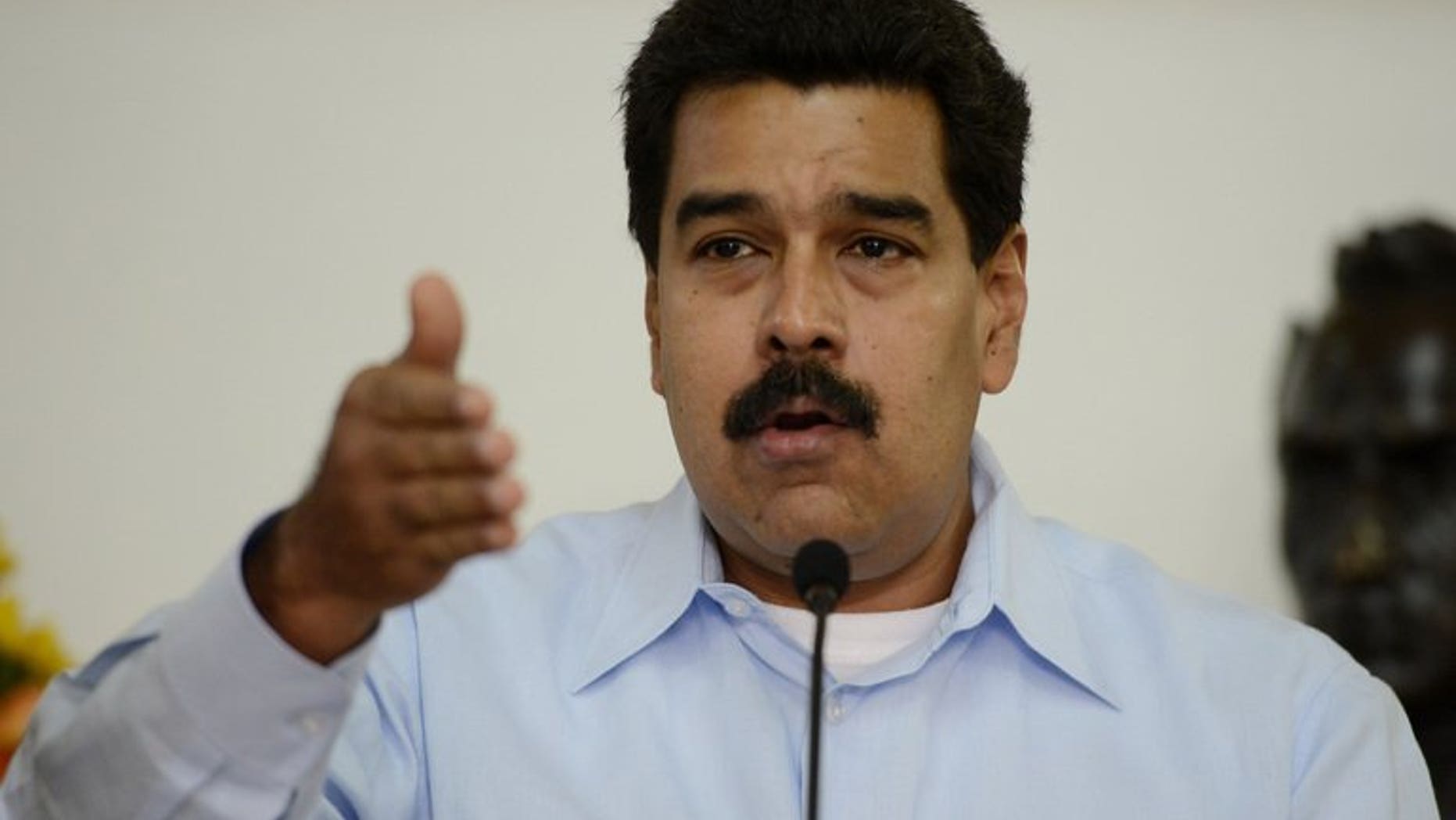 Venezuelan President Nicolas Maduro talks during a press conference at the Miraflores Presidential Palace in Caracas on September 9, 2013.