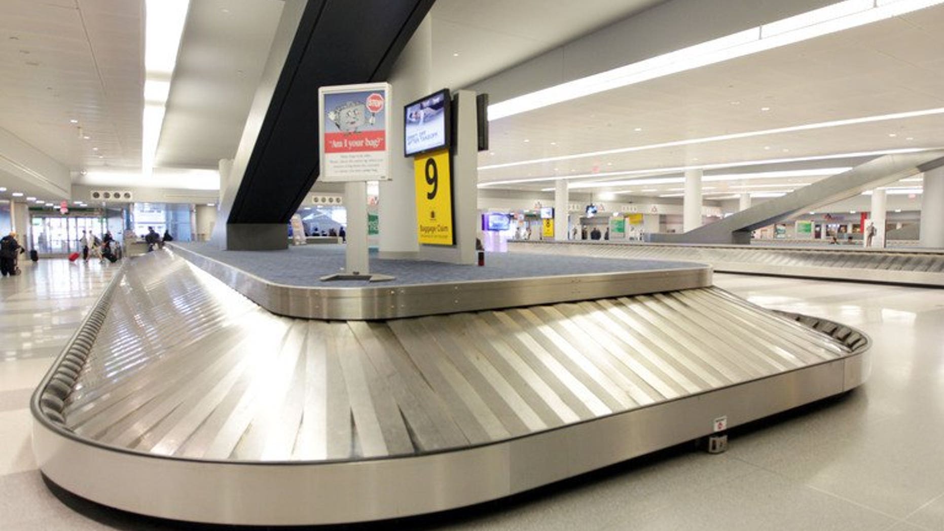 An empty baggage return area at New York's John F. Kennedy International Airport on October 31, 2012. A five-month-old baby died in a Spanish airport on Thursday after being placed on a luggage belt that then started moving without its parents noticing, officials said.