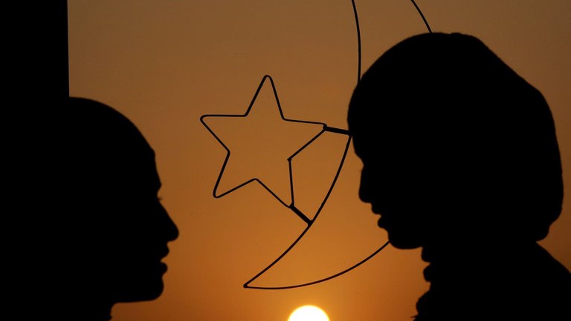 Women stand in front of a window decoration of Islam's crescent moon and a five point star. Tunisian women have travelled to Syria to wage "sex jihad" by comforting Islamist fighters battling the regime there, Interior Minister Lotfi ben Jeddou has told MPs.