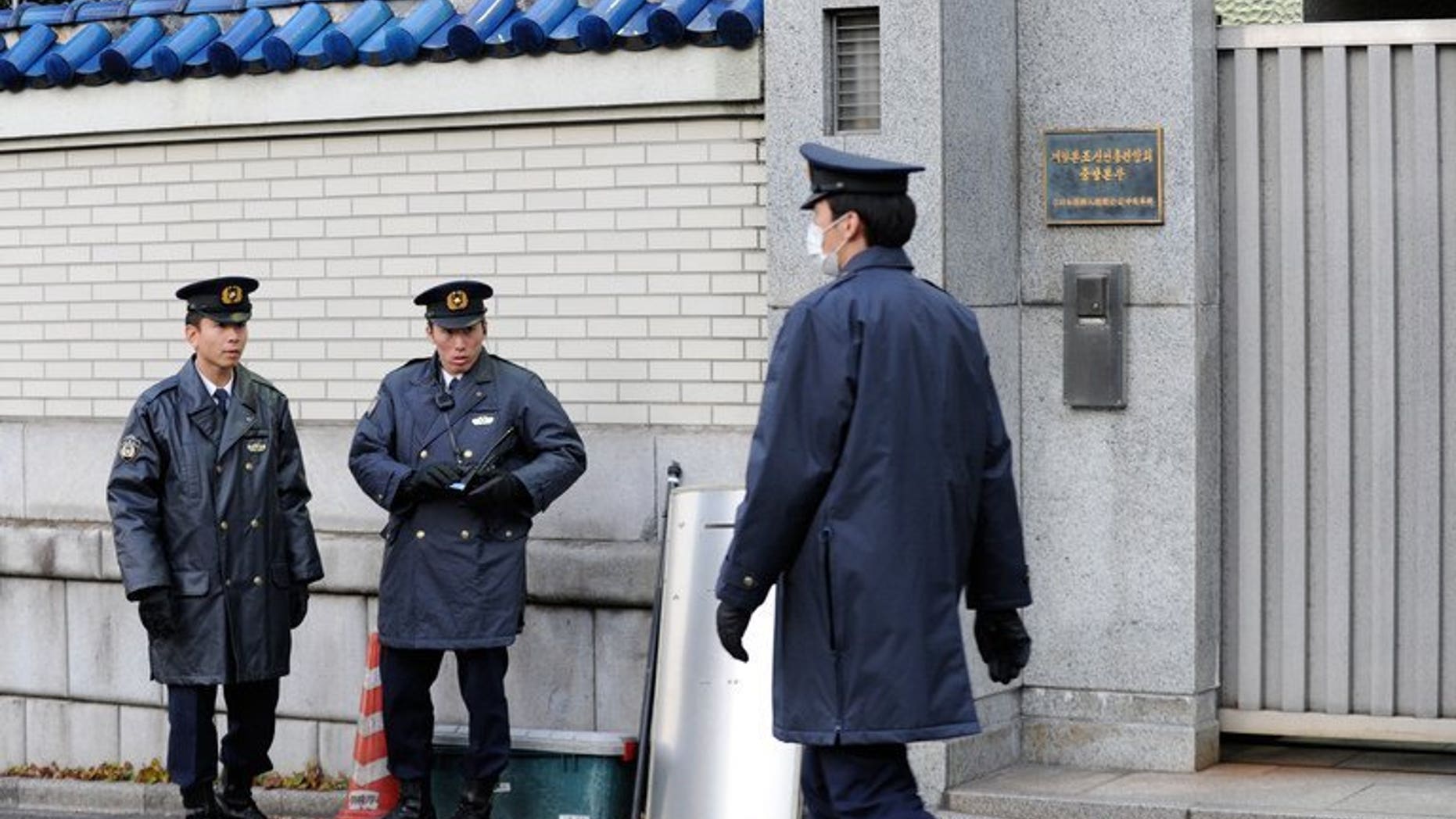 File picture shows policemen in Tokyo on December 19, 2011. Seven people who allegedly dissolved the body of a gigolo-club owner using chemicals found in drain cleaner have been arrested by Japanese police, officials and media reports said Friday.