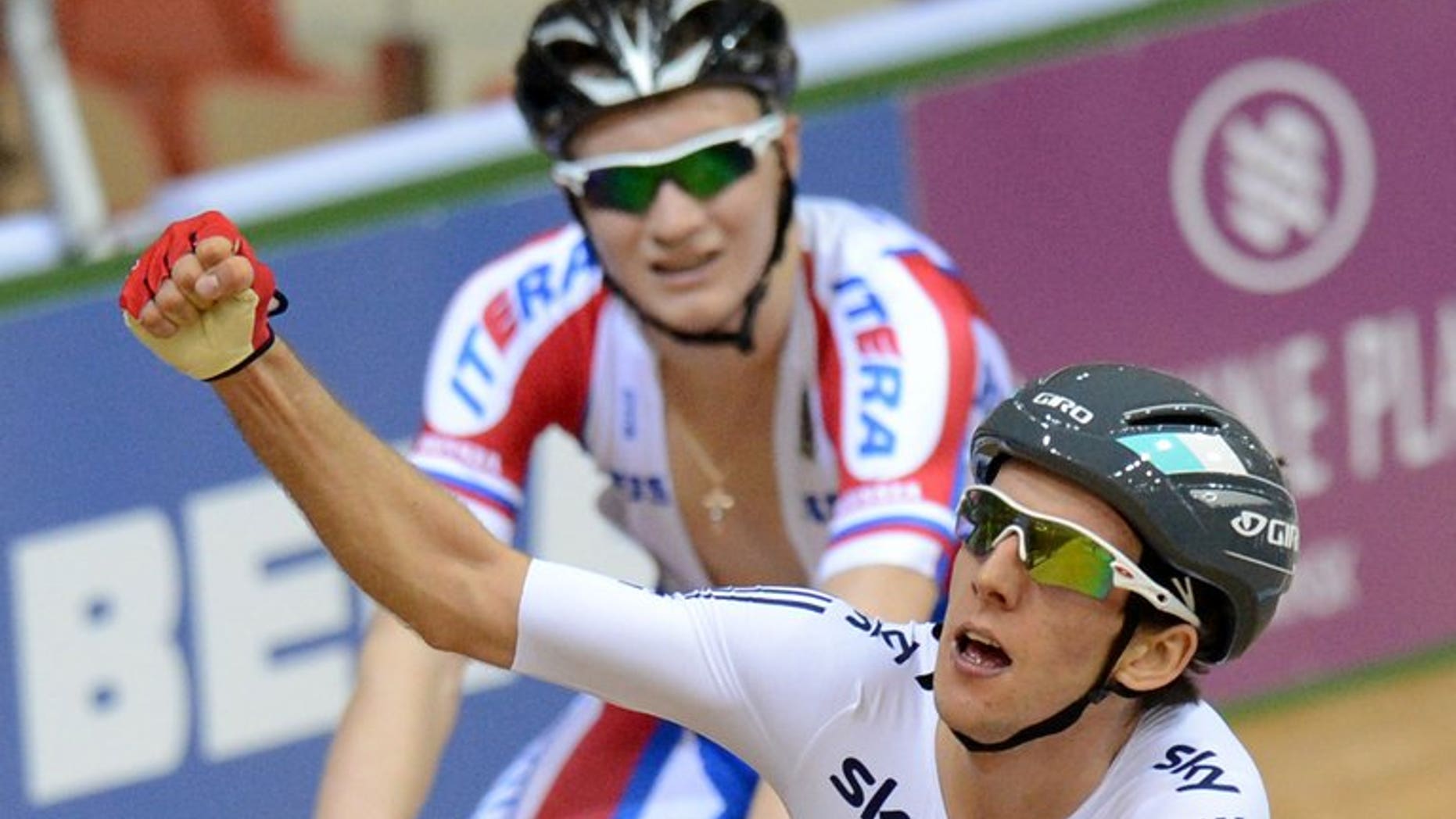 Britain's Simon Yates (right) and Russia's Kirill Sveshnikov react after a UCI Track Cycling World Championships race in Minsk on February 22, 2013. Yates won the Tour of Britain's first 'mountain' stage as he crossed the line in front on Haytor Rocks in Dartmoor.