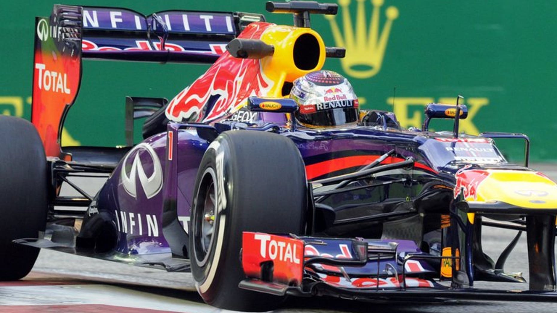 Red Bull driver Sebastian Vettel of Germany speeds around a corner during the first practice session of the Formula One Singapore Grand Prix on September 20, 2013. Vettel set a scorching pace as he dominated free practice at the Singapore Grand Prix in ominous style.