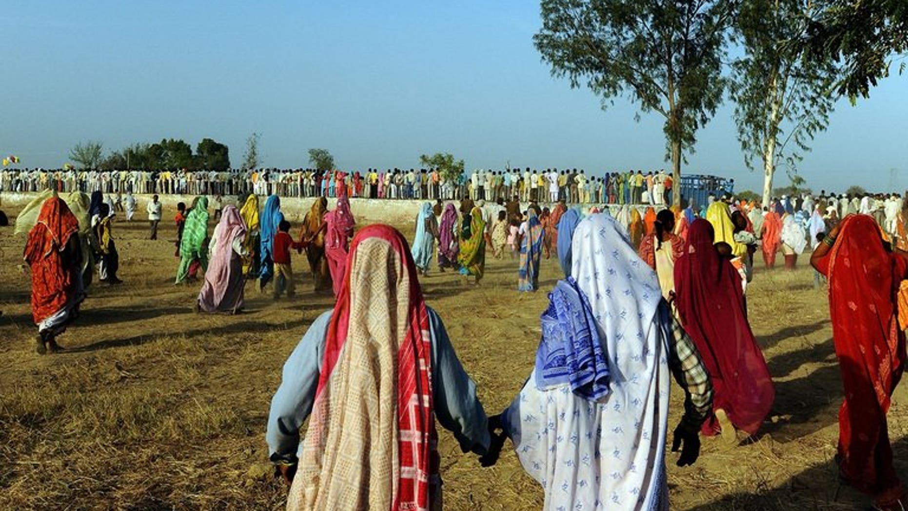 File picture shows people gathering at a public rally at Kondal village in the Palwal district of the Indian state of Haryana on March 1, 2009.