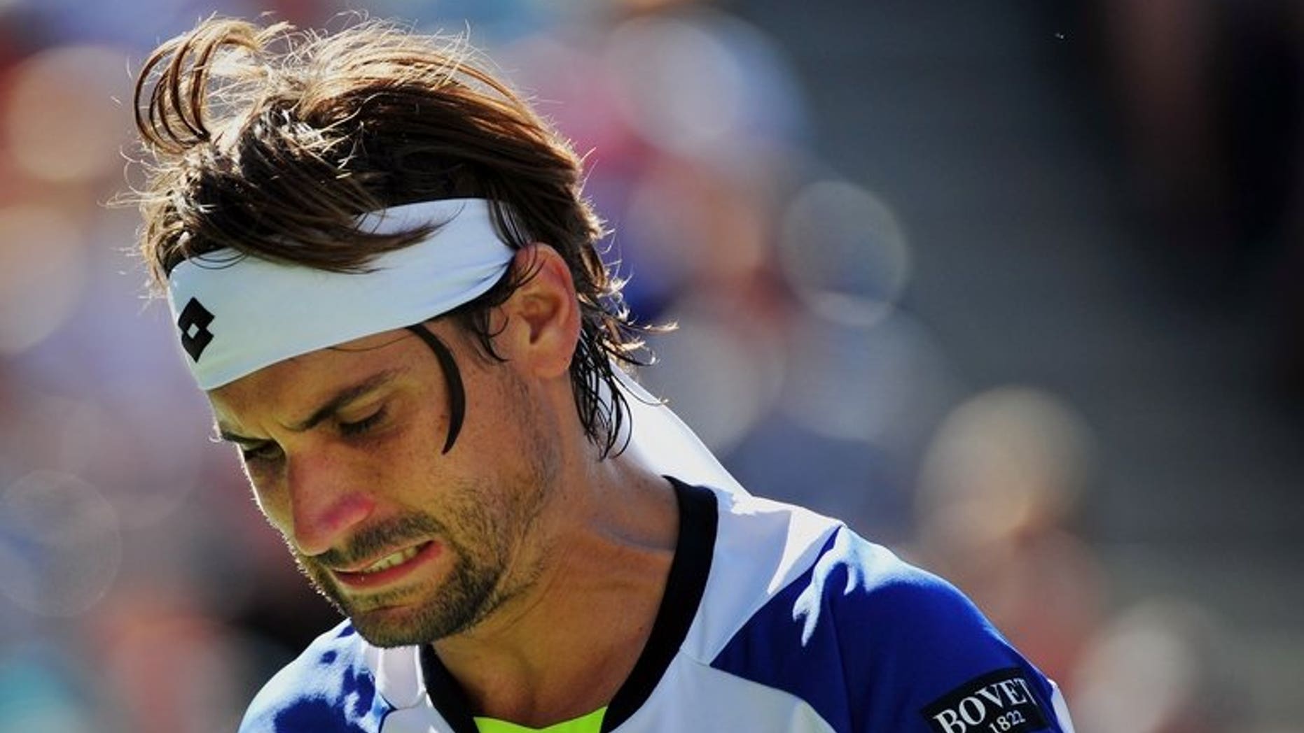 David Ferrer of Spain misses a shot against Richard Gasquet of France during their 2013 US Open men's singles quarterfinal match at the USTA Billie Jean King National Tennis Center September 4, 2013 in New York. Ferrer returns to Kuala Lumpur to headline the Malaysian Open, aiming to get back the winning feeling after an inconsistent year.