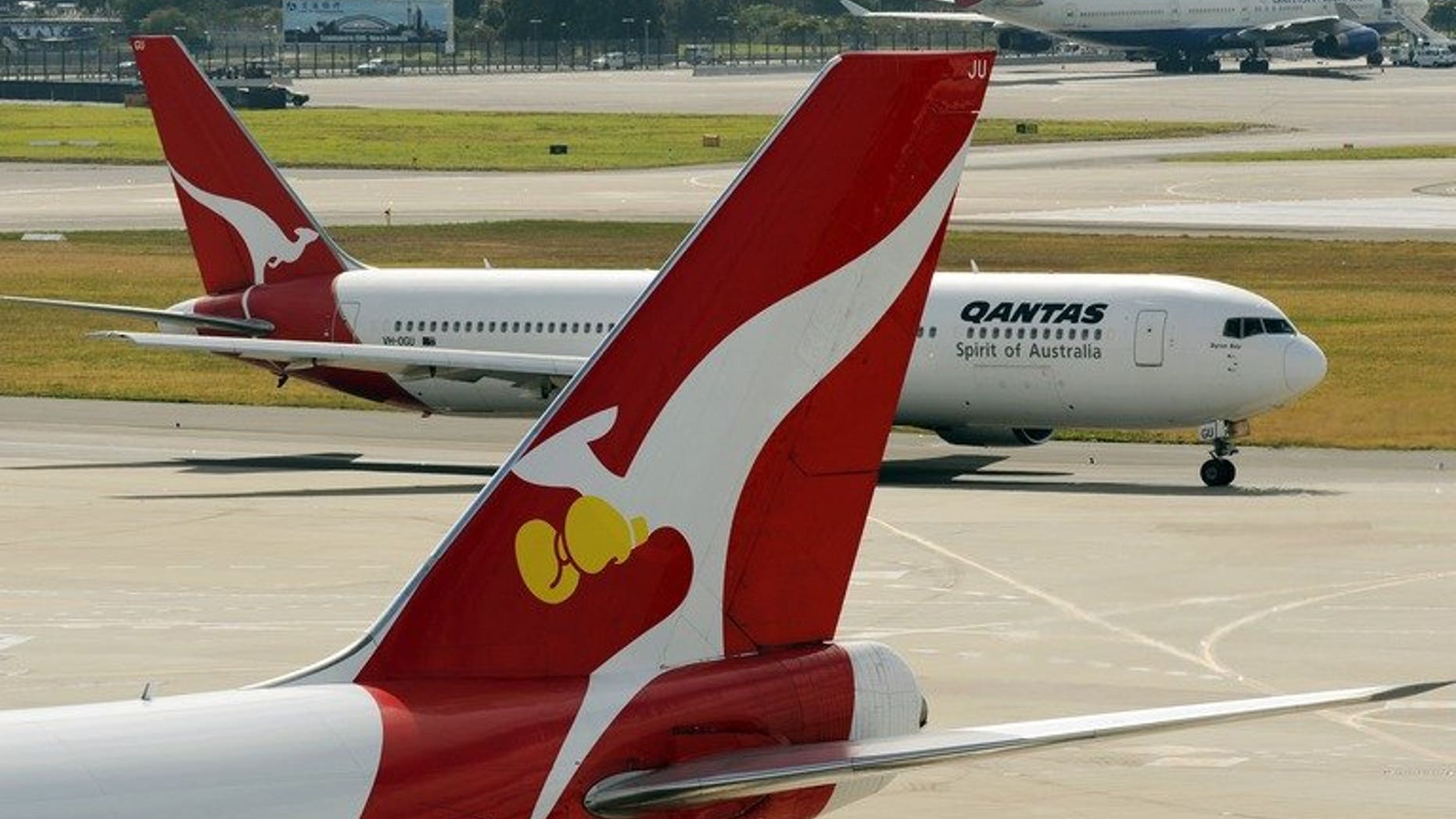 Two Qantas planes at Sydney International Airport, on August 22, 2012. Australian authorities are investigating how two Qantas planes got so close that it triggered a collision warning alert, forcing them to take evasive action.