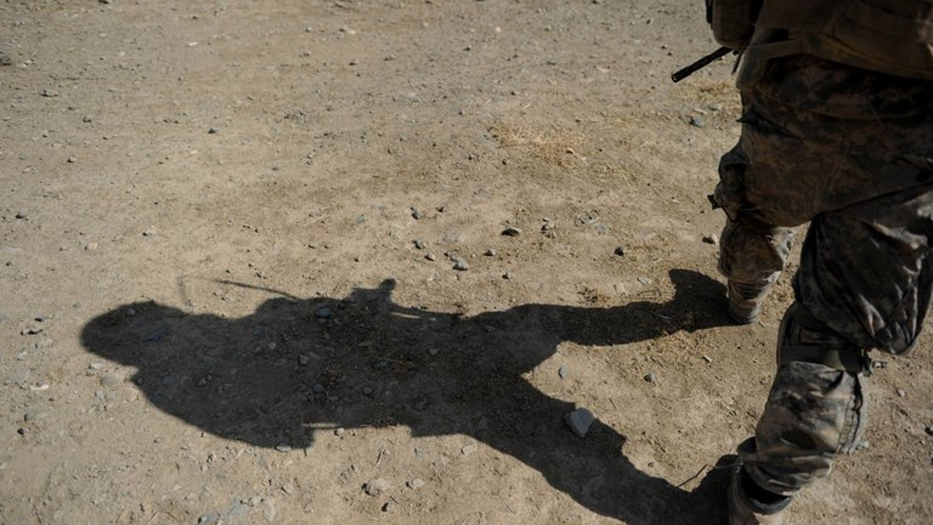 A US Soldier serving with the NATO-led mission in Afghanistan in Kandahar province on August 6, 2010. A man wearing Afghan security forces uniform shot dead three NATO-led soldiers on Saturday in the eastern part of the country, the coalition said.